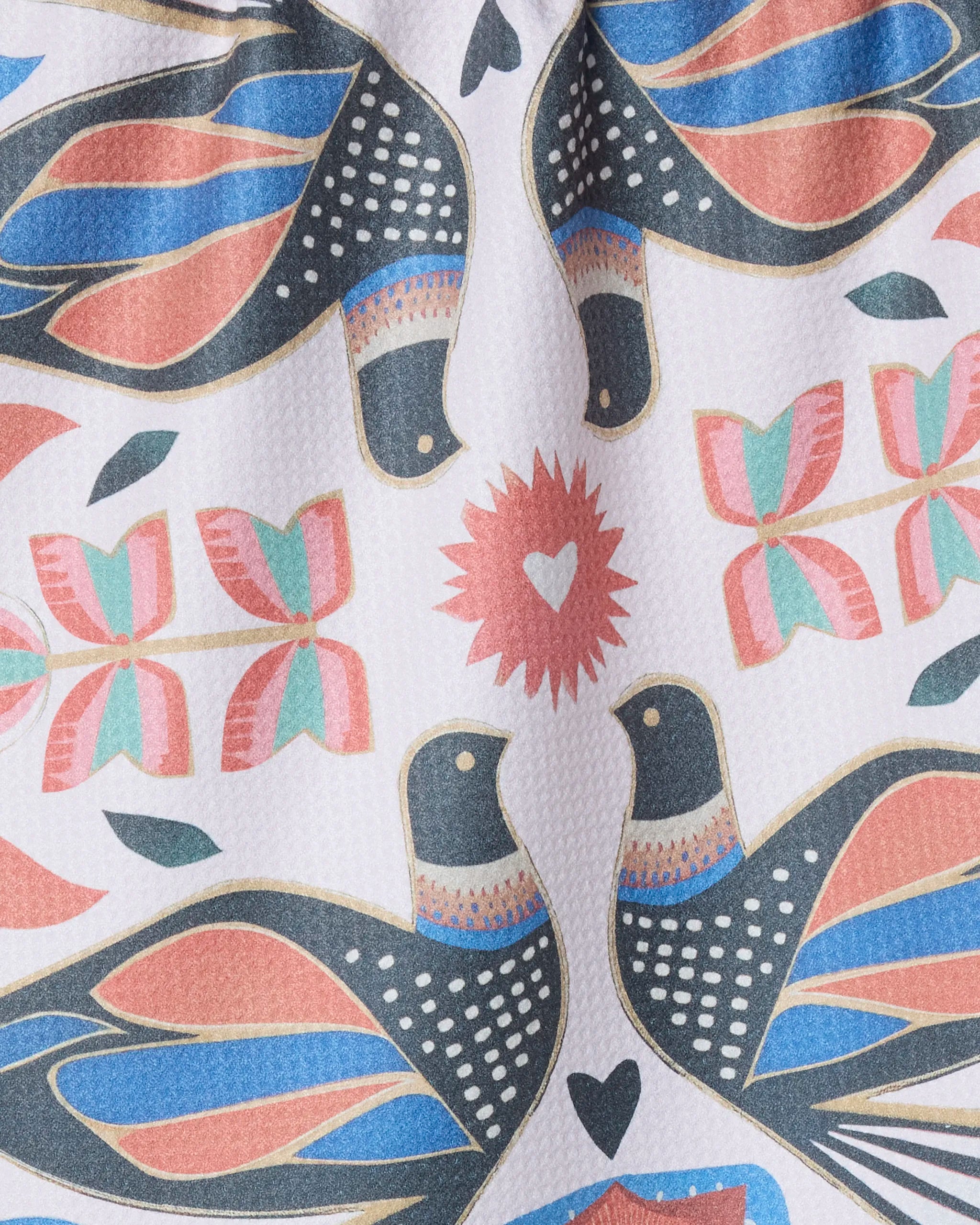 The Geometry Scandi Lovebirds kitchen tea towel features stylized birds with black, blue, and pink wings among soft-hued geometric flowers and heart shapes, all crafted from recycled materials on a white background.