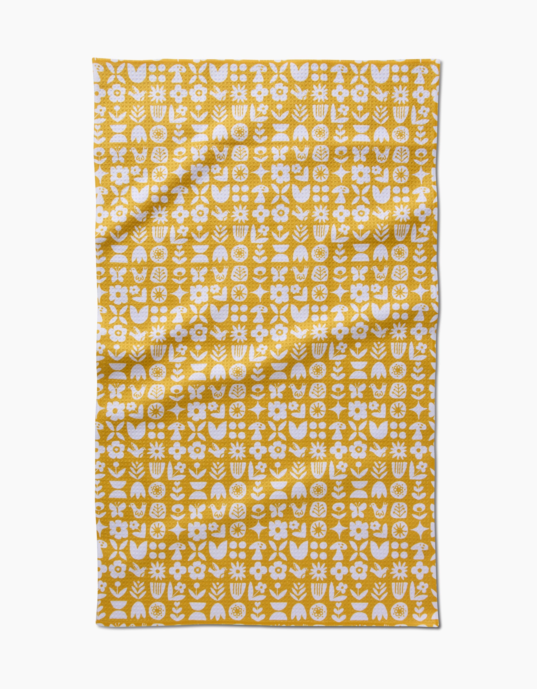 The Kayla Ann “Scandi Spring” Tea Towel features a yellow background with white abstract floral and geometric patterns in neat rows and columns, crafted from Geoweave fabric for a modern, textured look.