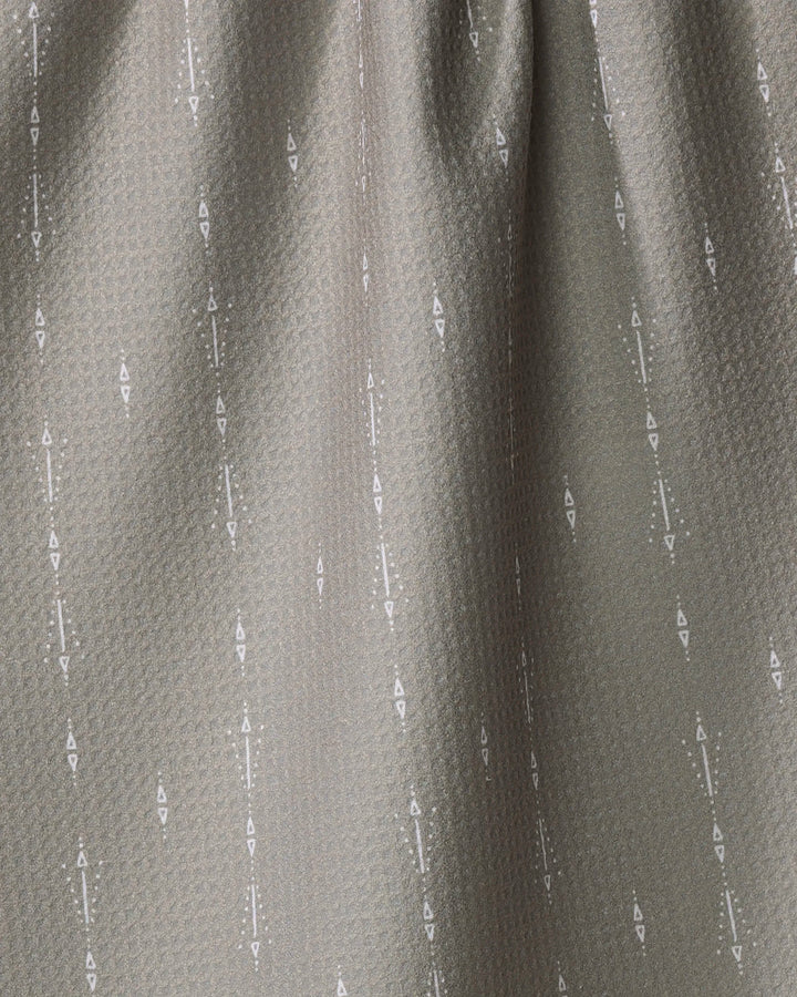 A close-up of Hufton Studio's Scandi Trails shows textured gray fabric made from recycled materials, with a subtle diamond pattern and vertical white geometric arrow and dot designs. The fabric appears slightly gathered at the top.
