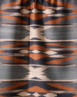 The Geometry Sedona tea towel features a geometric textile pattern with horizontal bands in orange, navy, white, and gray, showcasing symmetrical diamonds and zigzags—perfect for brightening your kitchen with its quick-drying design.