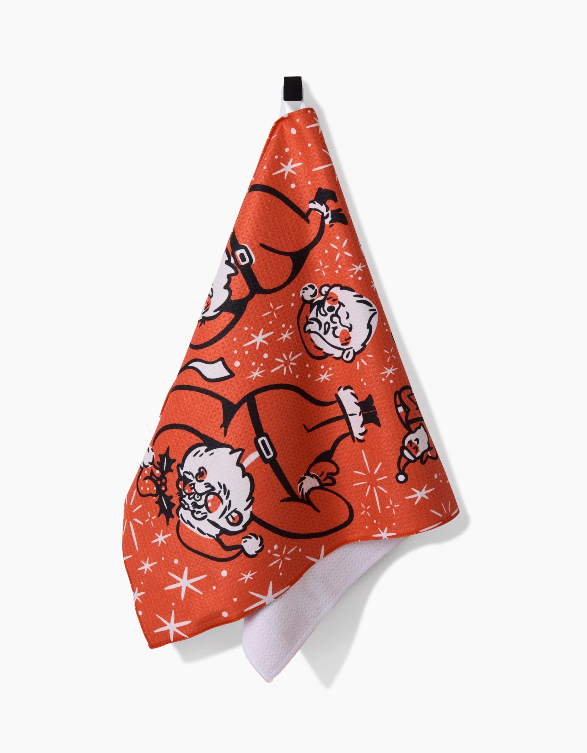 The Carly Berry Sexy Santa is a red, ultra-absorbent kitchen tea towel with a festive cartoon Santa and white starburst pattern, hanging from a black loop.