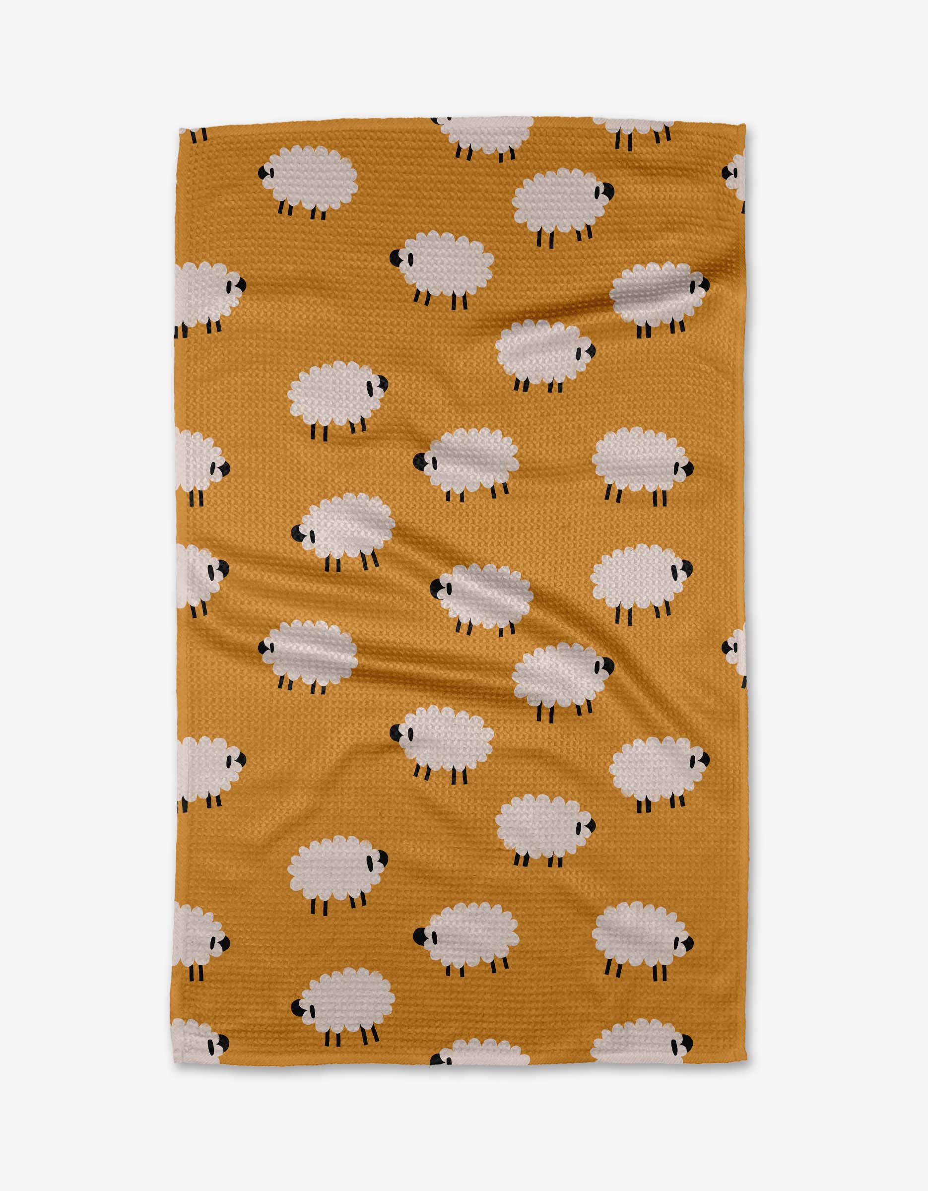 The Jennifer Bouron Sheep kitchen tea towel is ultra-absorbent, made from recycled materials, and features a mustard yellow color with evenly arranged white cartoon sheep with black faces and legs.