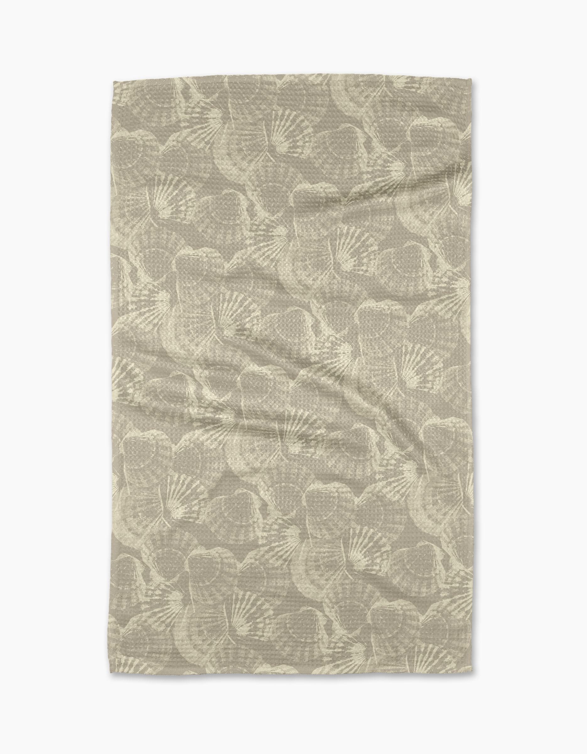 The Shell Whisper tea towel by Geometry features a beige Geoweave™ fabric with an abstract, fan-shaped pattern in lighter tones evenly spread across the surface.