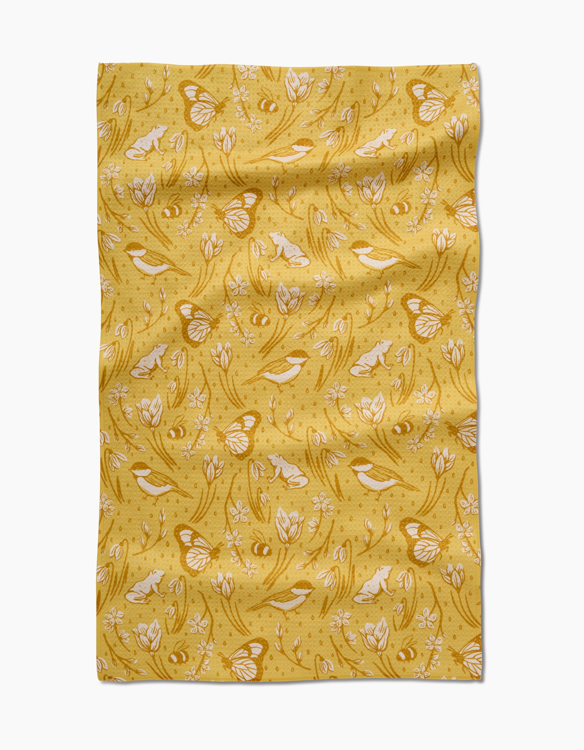 The Signs of Spring tea towel by Sarah Daugherty features a whimsical white and gold design of butterflies, birds, flowers, and leaves on yellow Geoweave fabric—ultra-absorbent with a charming, slightly wrinkled texture.