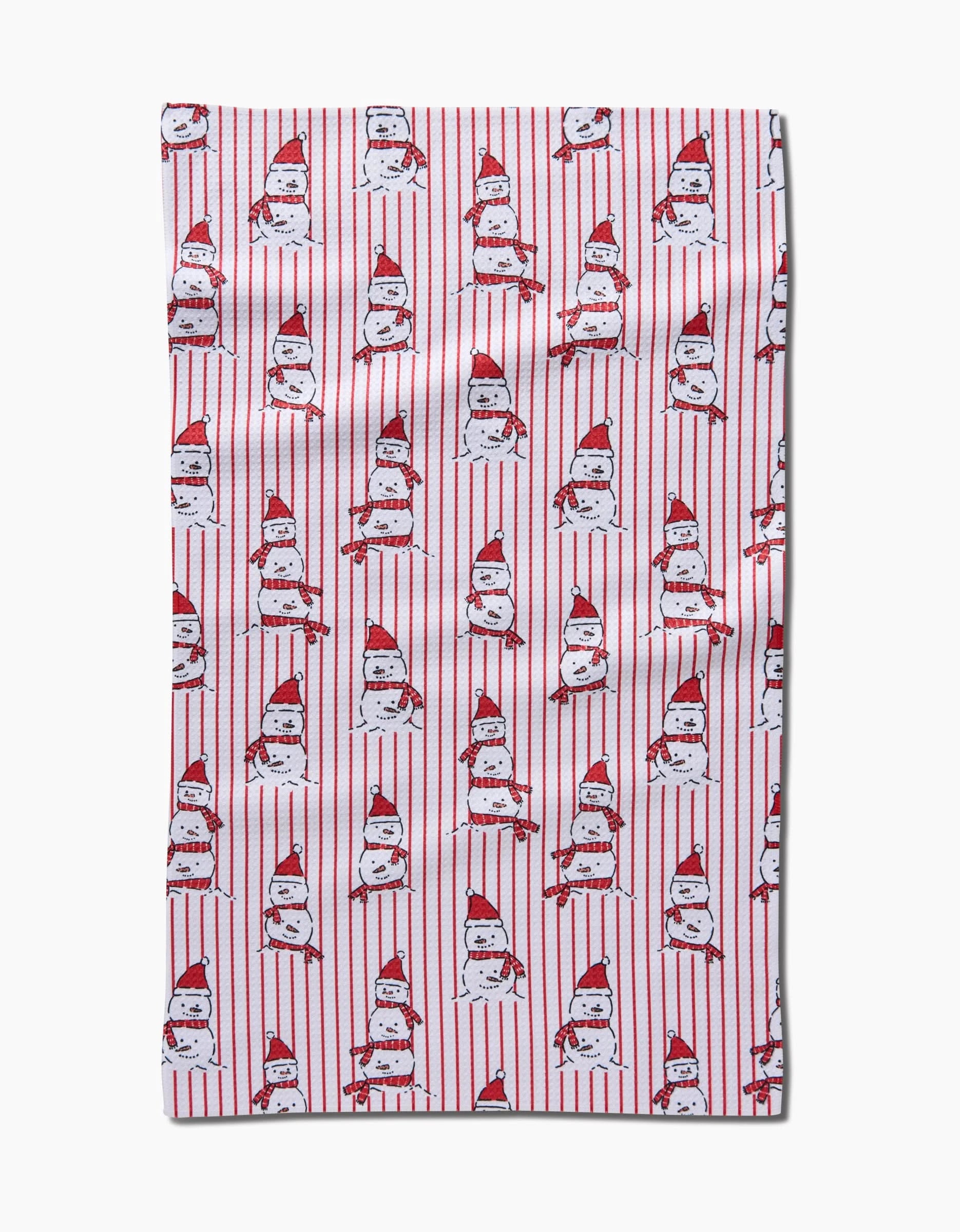 Bring holiday cheer to your kitchen with the Silly Snowman towel by Hufton Studio, featuring playful snowmen in red Santa hats and scarves, arranged in rows on a white background with vertical red stripes.