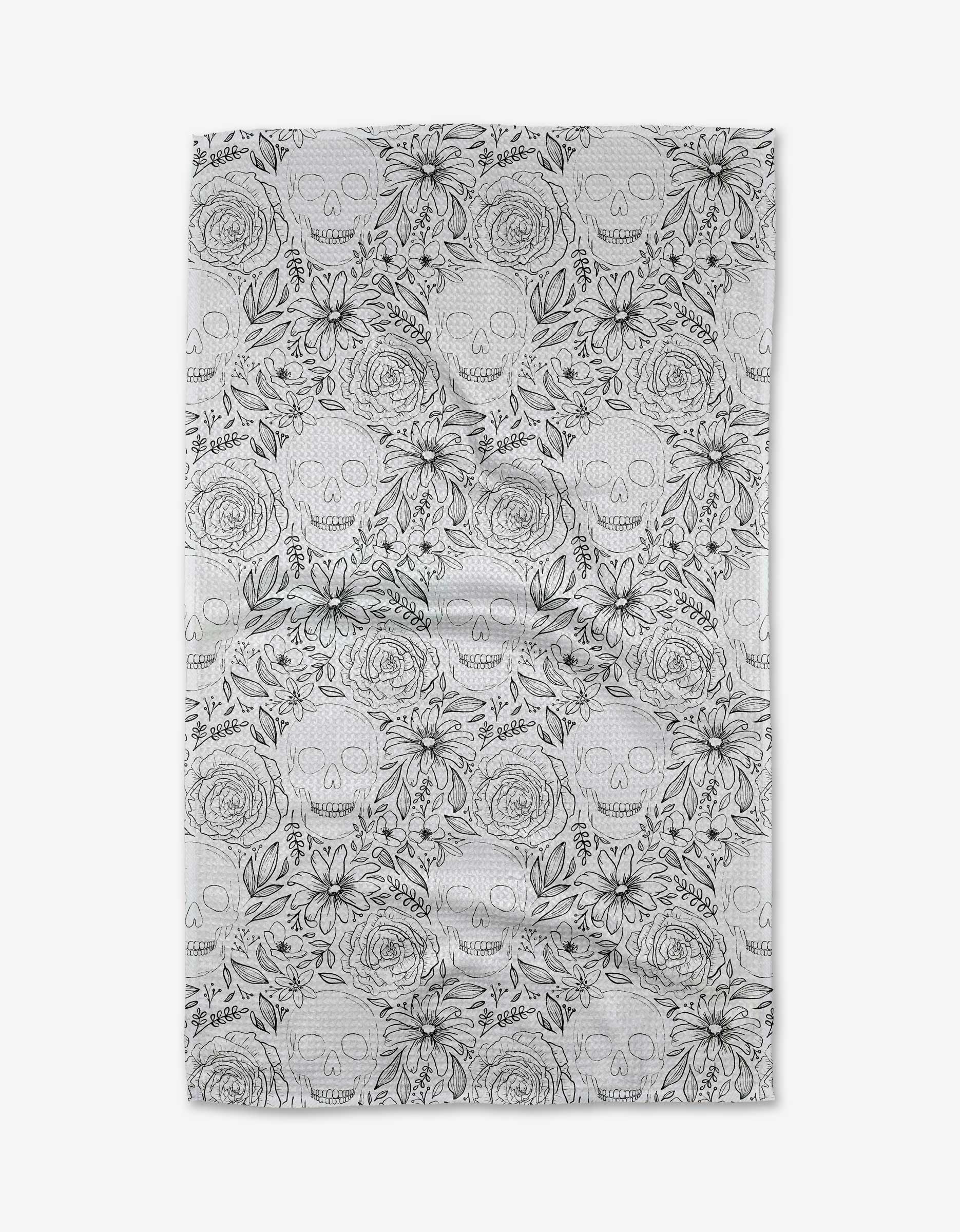 The Skulls and Flowers kitchen towel by Rosa Kichline features a white rectangular design with black line art of skulls, roses, daisies, and leaves, crafted from recycled materials for an eco-friendly touch.