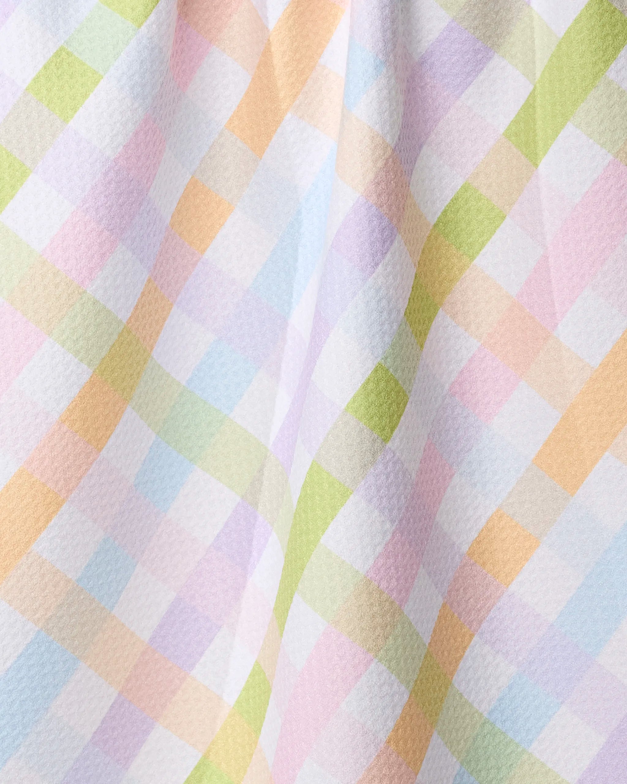A close-up of the Geometry Spring Basket tea towel, crafted from recycled materials.