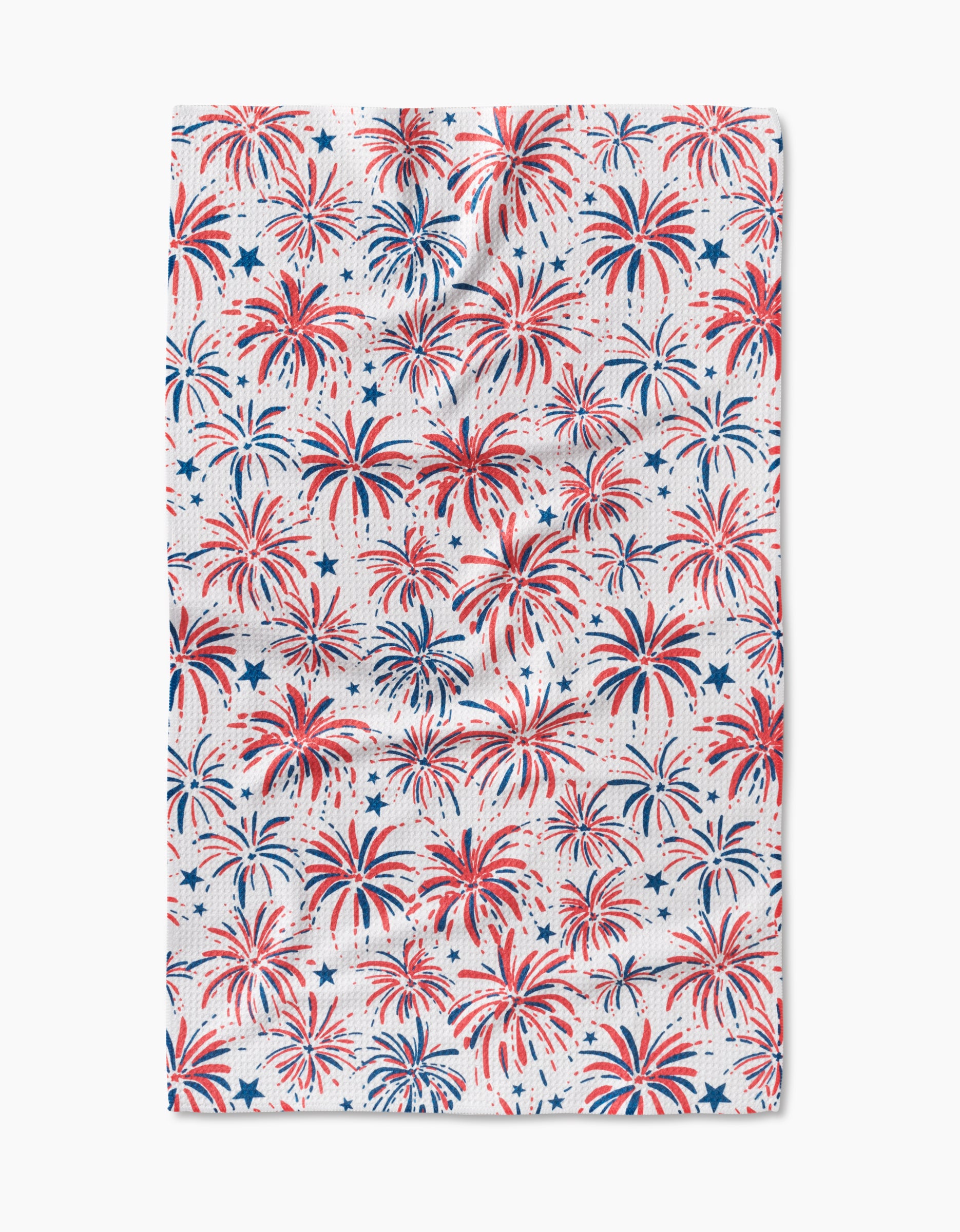 The Stars And Fireworks tea towel by Hufton Studio features a festive red and blue fireworks and star pattern, crafted from premium Geoweave fabric for exceptional softness and durability.