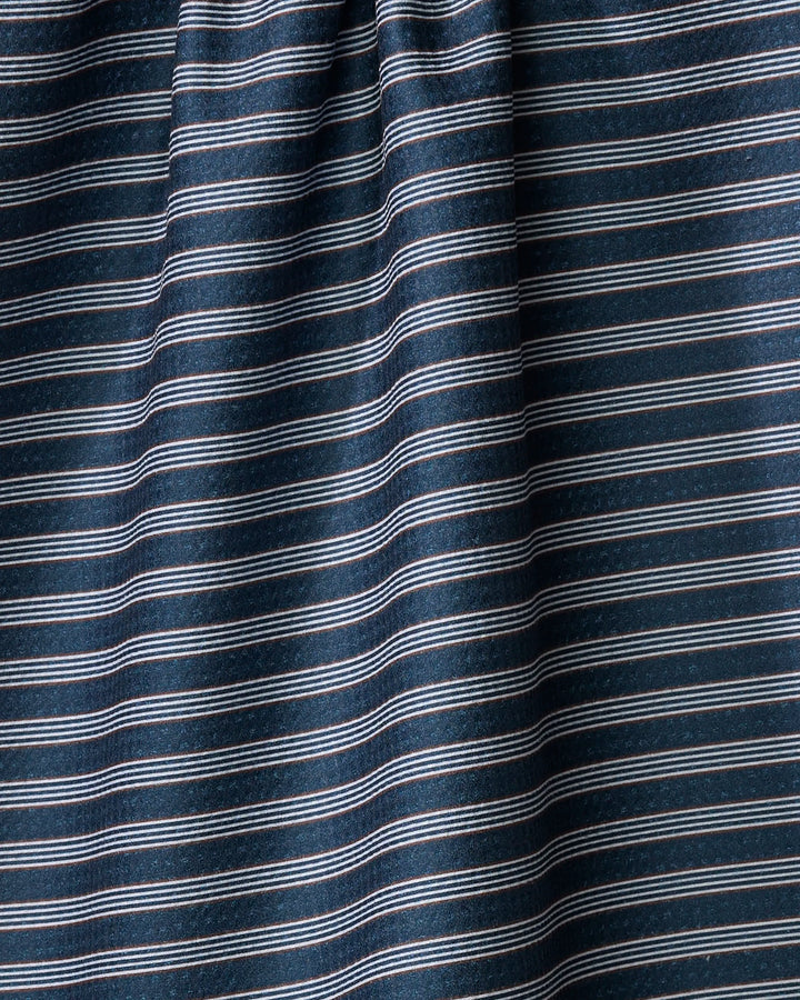 A close-up of The Buy Guide's Straight Across - Navy fabric shows dark blue material with thin white horizontal stripes and subtle ripples, creating a textured, absorbent dish towel-like appearance.