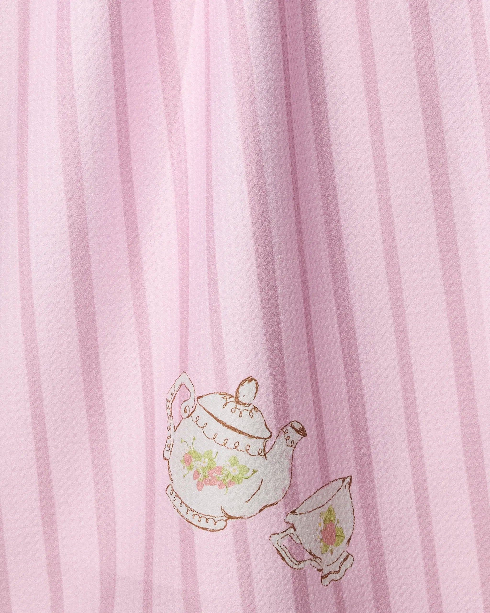 Strawberry Spring by Geometry features pink fabric with vertical pastel stripes and a delicate floral teapot and teacup design—an eco-friendly tea towel perfect for your kitchen.