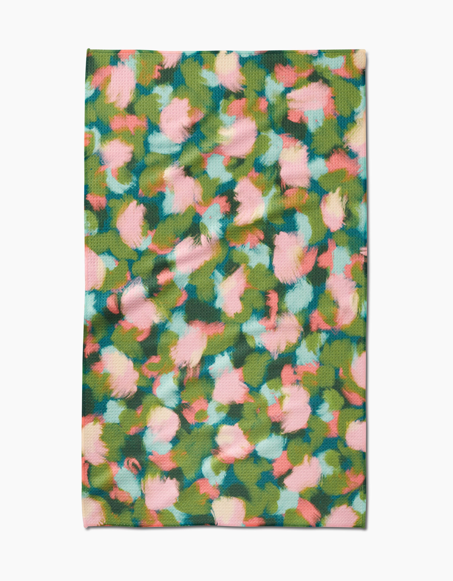 Stroke of Genius by Shelley Smith is a rectangular Geoweave fabric with an abstract floral pattern in green, pink, blue, and yellow, shown flat on a white background.
