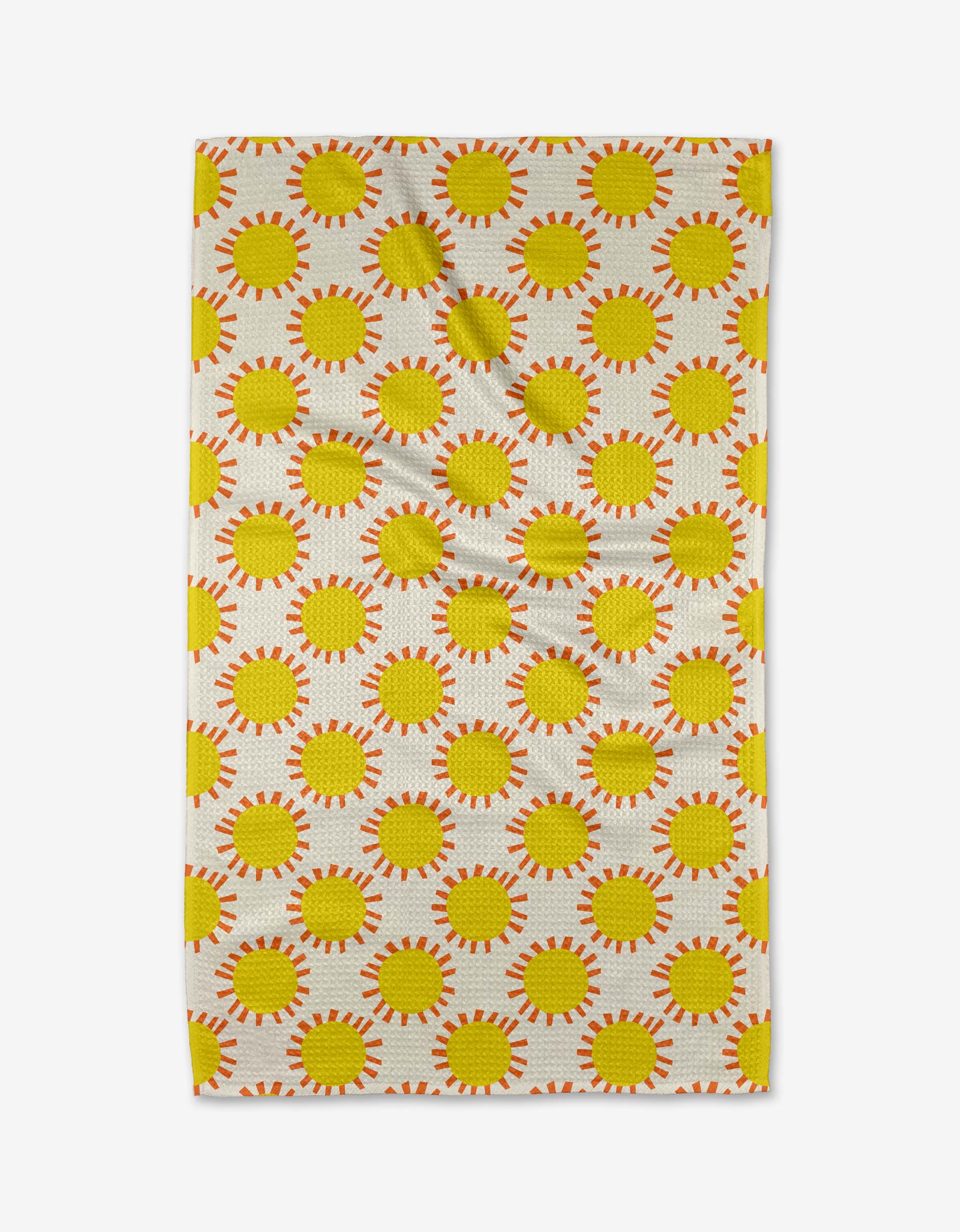 The Sunny Day Tea Towel by Lizzie Clark features a repeating pattern of yellow suns with orange rays on a light background. Made from Geoweave™ fabric, it has visible creases and is displayed on a white surface.