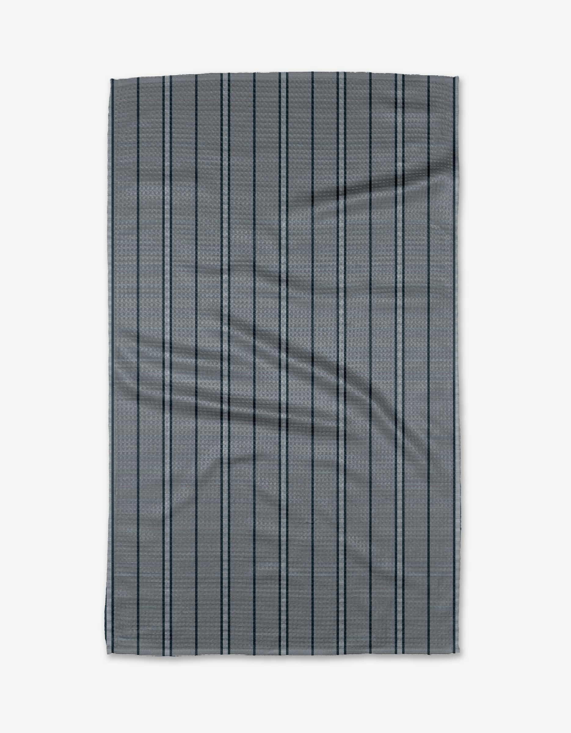 A rectangular navy Super Stripe tea towel by The Buy Guide features bold dark stripes. Made from Geoweave fabric, it has slight wrinkles and is laid flat on a white background.
