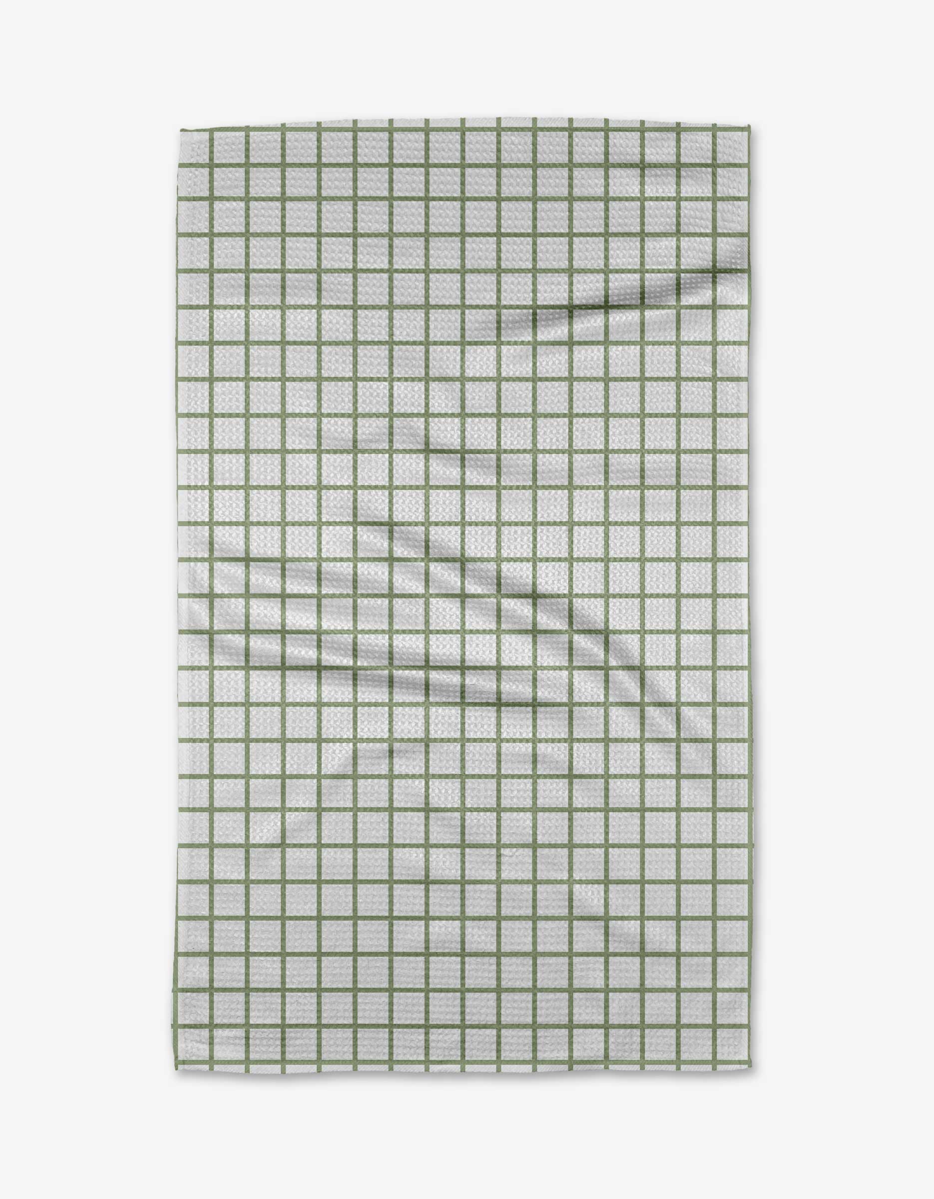 The Kailee Wright Sweet Mint towel is a white Geoweave cloth with a green grid pattern, showing a few visible folds and wrinkles.