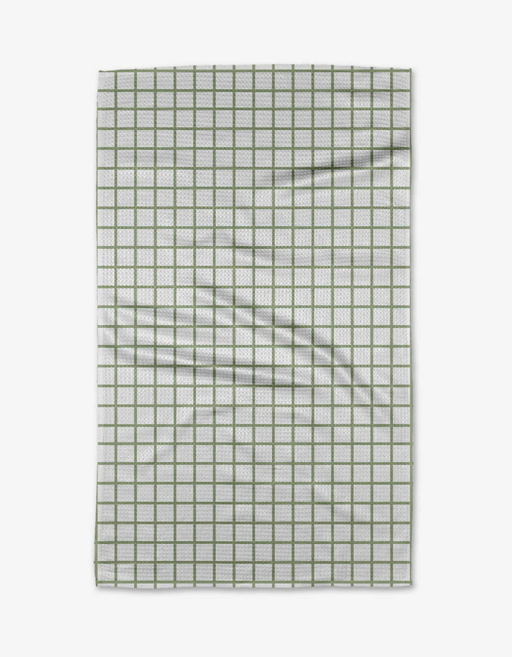 The Kailee Wright Sweet Mint towel is a white Geoweave cloth with a green grid pattern, showing a few visible folds and wrinkles.