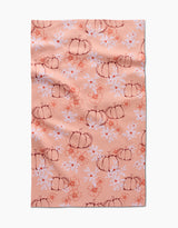 The Sweet Pumpkin Harvest by Ashley Celena is a peach recycled kitchen towel with hand-drawn pumpkins, white daisies, and orange floral accents. Ultra-absorbent with a charming, slightly wrinkled finish.