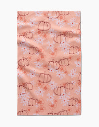The Sweet Pumpkin Harvest by Ashley Celena is a peach recycled kitchen towel with hand-drawn pumpkins, white daisies, and orange floral accents. Ultra-absorbent with a charming, slightly wrinkled finish.