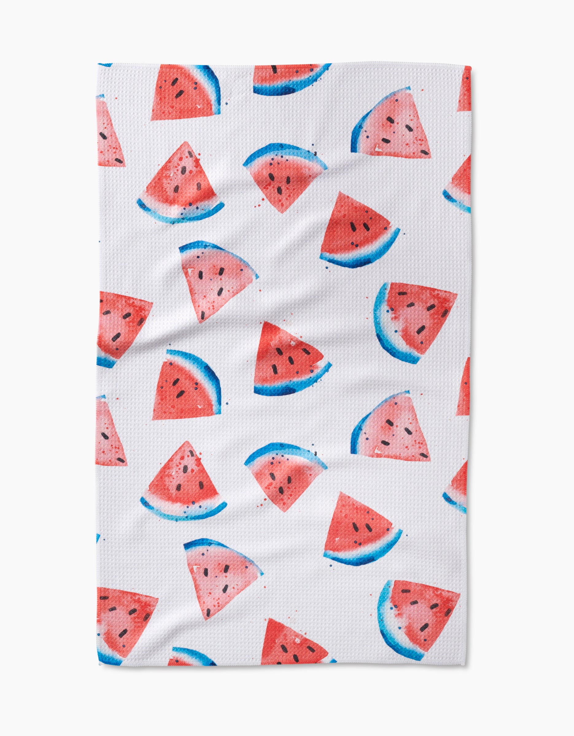The Sweet Slice Of July is a white tea towel with watercolor-style watermelon wedges and semicircles, evenly scattered across the surface, and made from recycled materials.