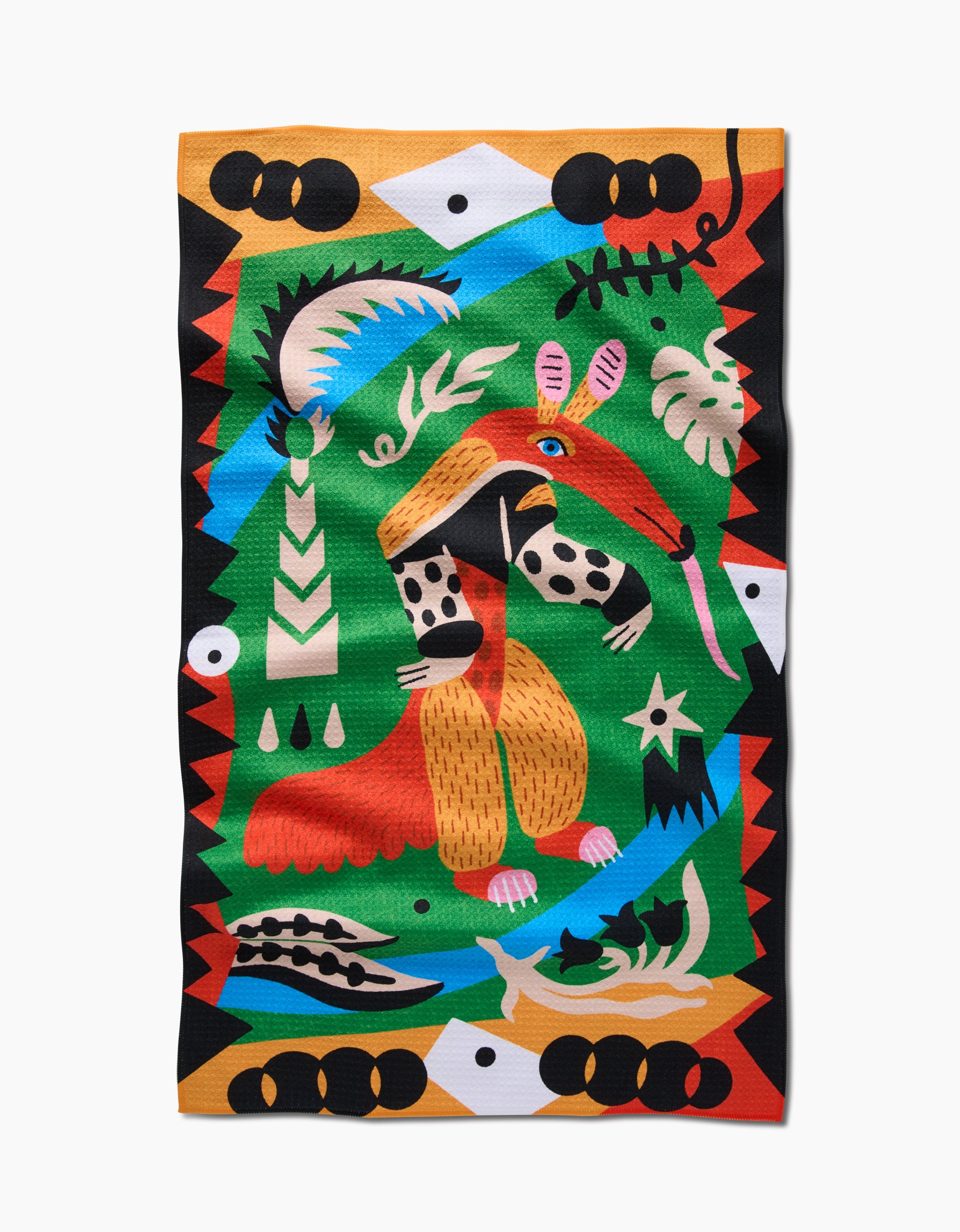 The Tamanduá Bandeira by Camila Leão features a colorful abstract anteater on textured Geoweave Fabric, with bold geometric shapes, tropical leaves, and vibrant green, orange, red, blue, black, and white patterns.