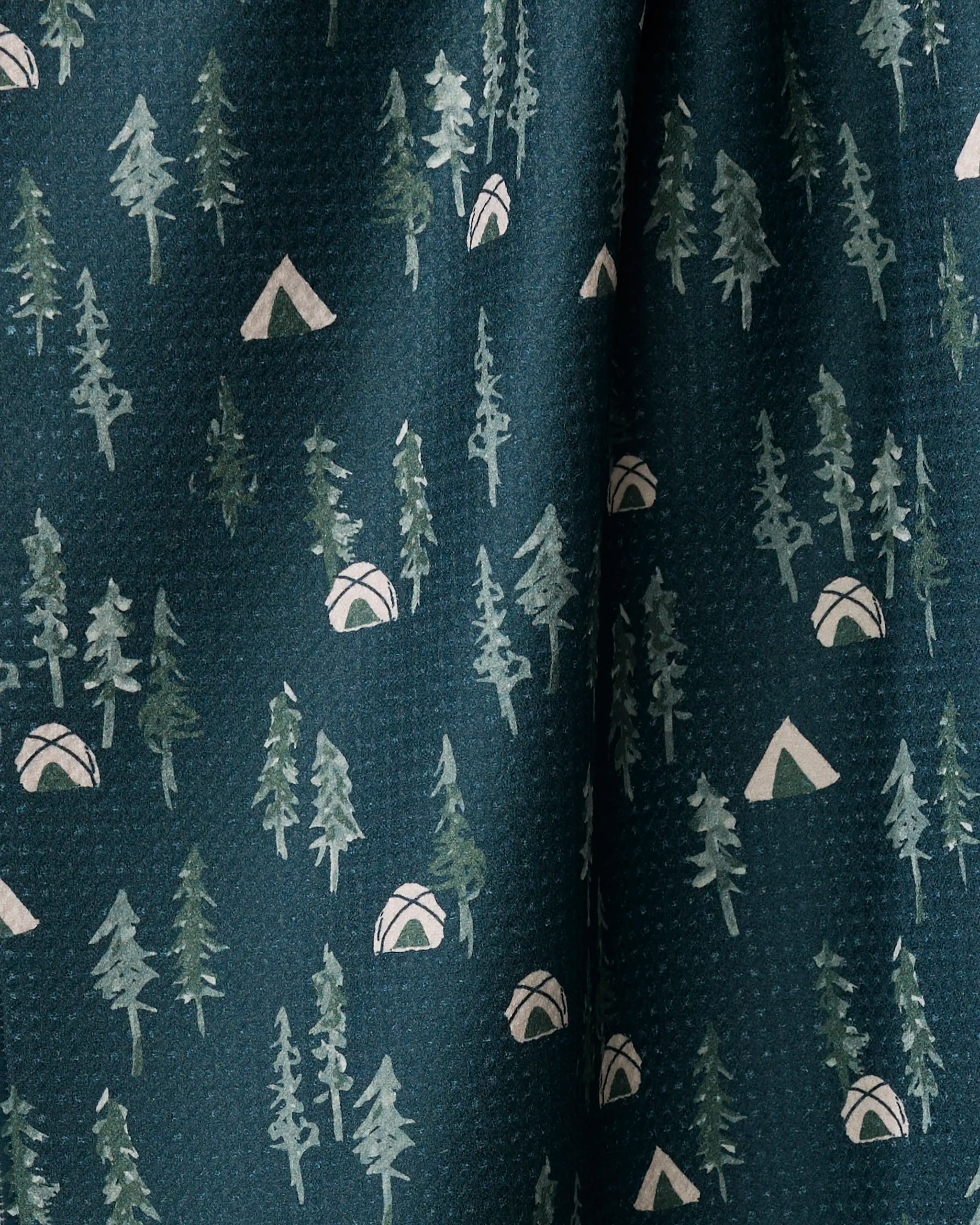 Twig + Spark's "Tiny Tents" tea towel features a dark green color with pine tree and beige tent illustrations for a charming camping vibe. Crafted from recycled materials, it's an eco-friendly addition to your kitchen.
