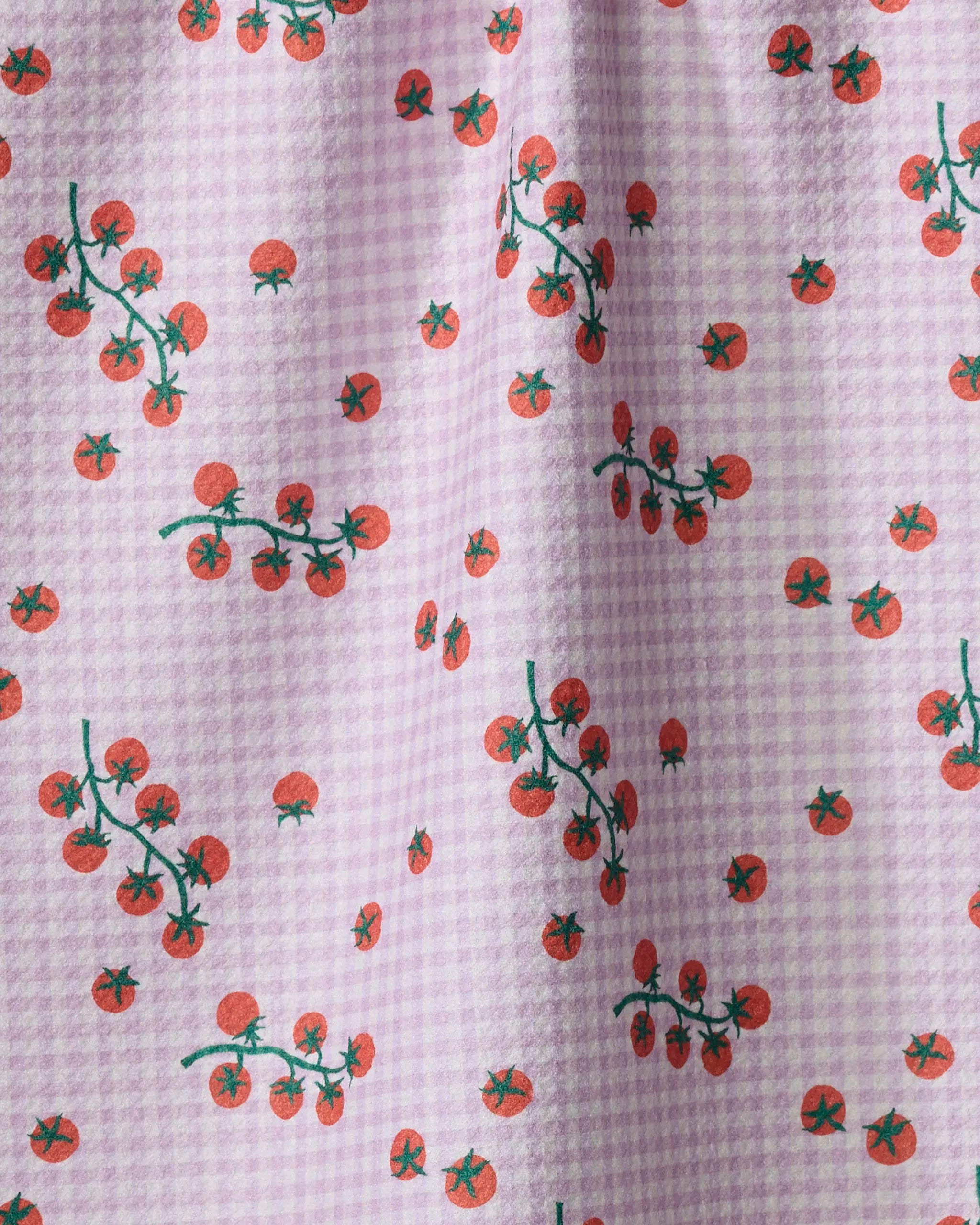 The Tomato Gingham kitchen towel by Brittany Jepsen features a light purple and white gingham pattern with small red tomatoes and green stems, crafted from recycled materials.