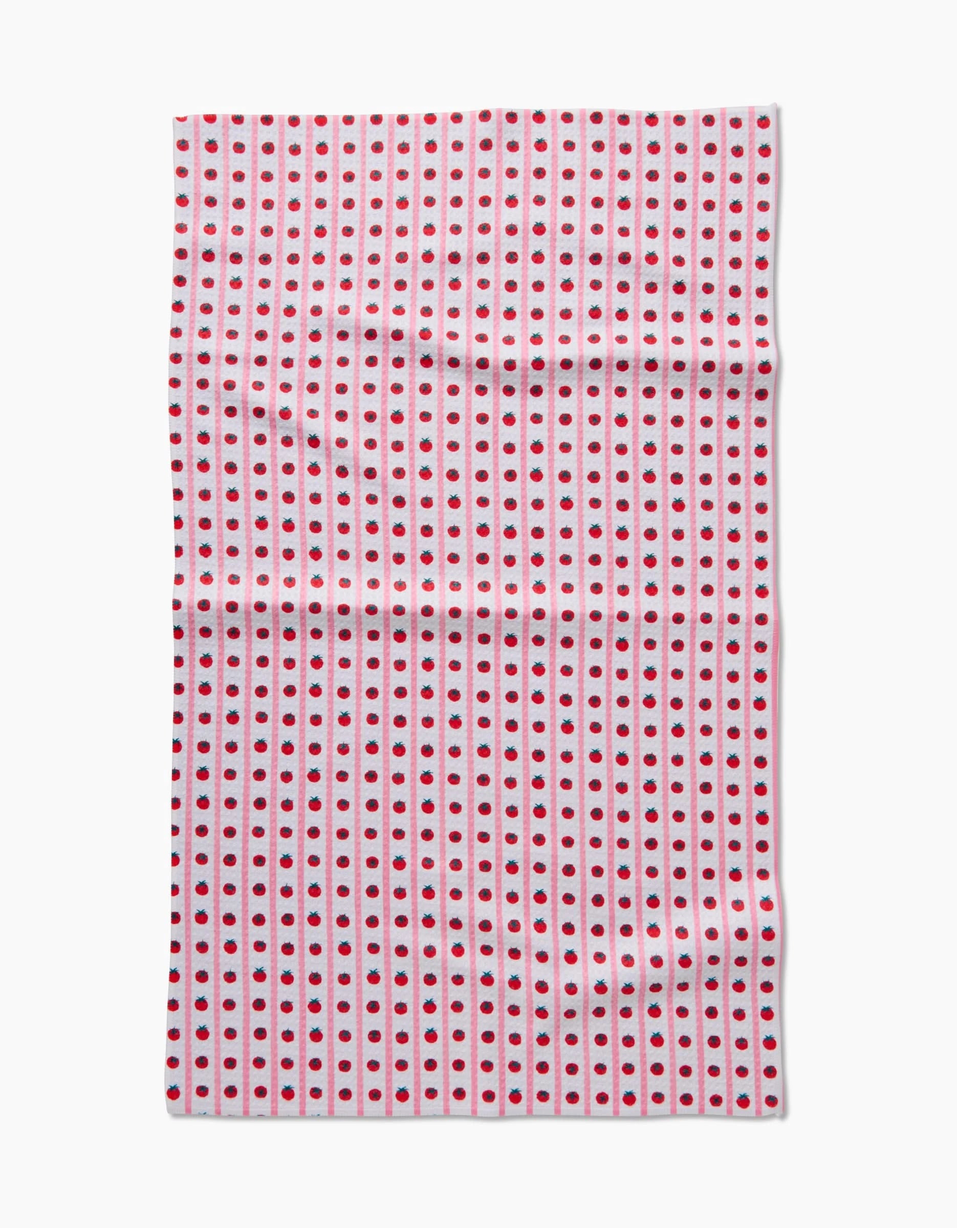The Tomato Stripes tea towel by Brittany Jepsen features white Geoweave™ fabric with evenly spaced red dots in vertical lines, shown flat with subtle creases.