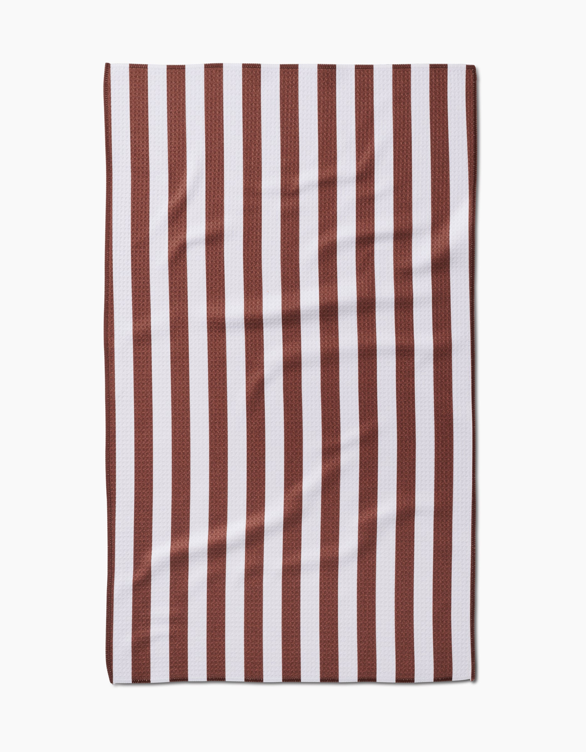 The Kailee Wright Toni Stripe Geoweave™ tea towel features vertical dark red and white stripes and a slightly wrinkled texture, shown laid flat on a white background.