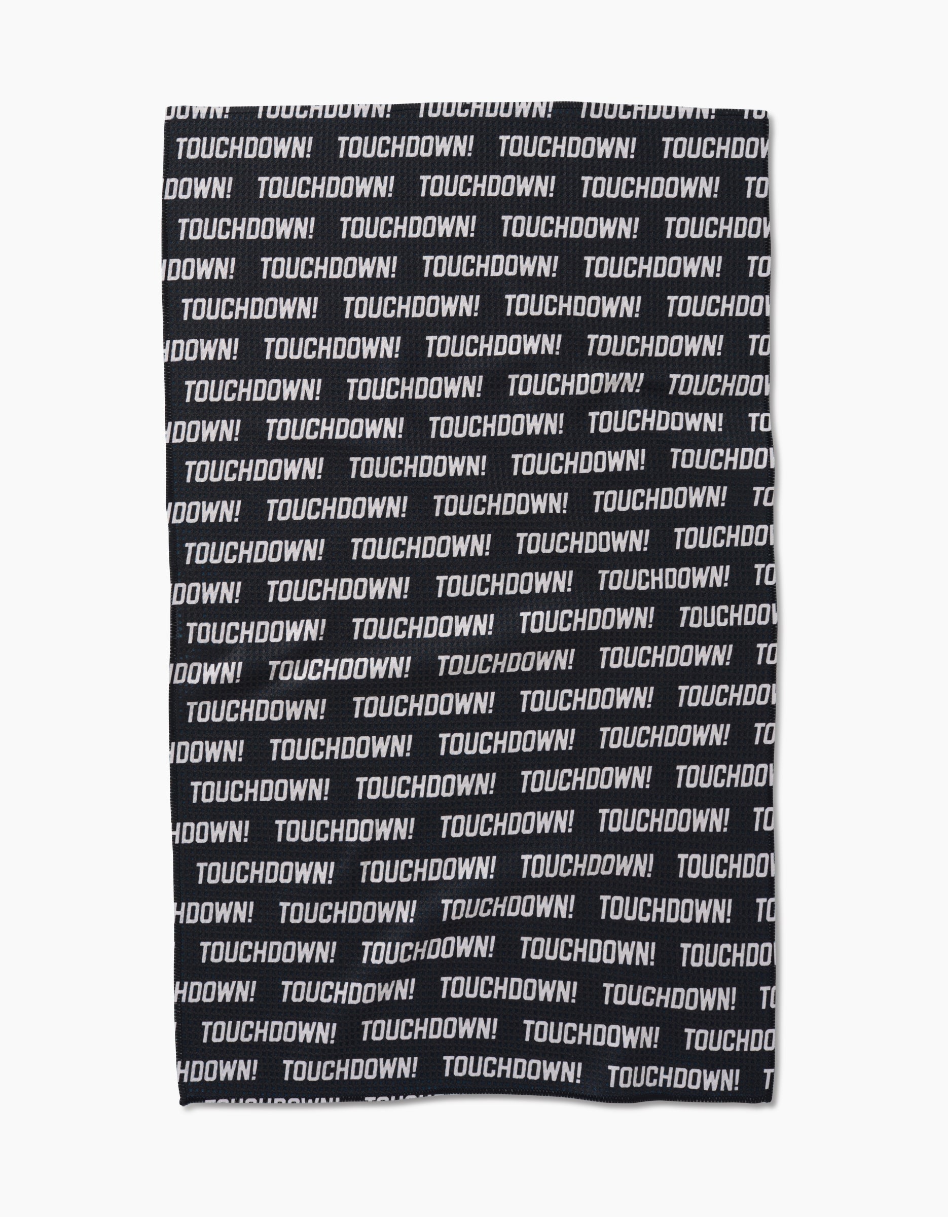 The GEOMETRY Touchdown tea towel is made from recycled materials and features TOUCHDOWN! in bold white uppercase letters, printed repeatedly across its black Geoweave fabric in a striking horizontal pattern.