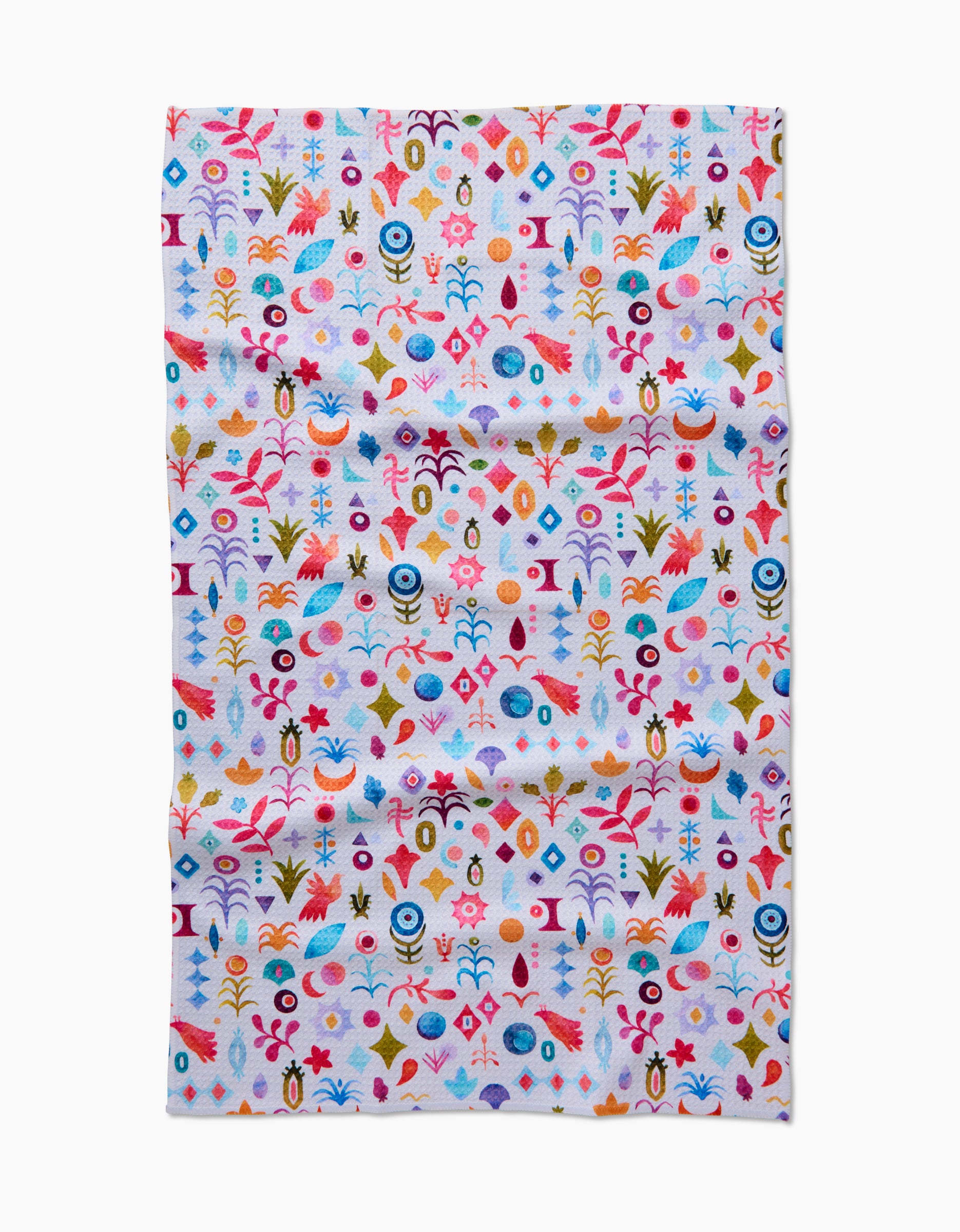 The Tula Tea Towel by Maayan Alper-Swan showcases a vibrant abstract floral and geometric pattern in red, blue, yellow, orange, and pink on white Geoweave fabric that is soft and eco-friendly.