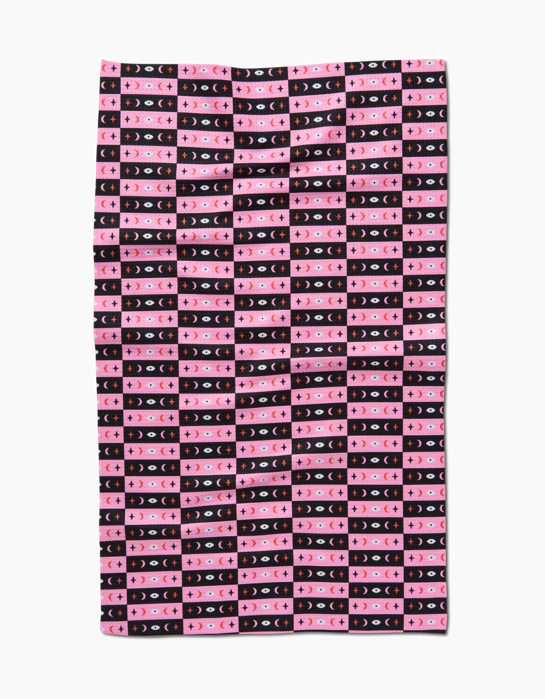 Laura Supniks Twinkling Eye Tea Towel features a geometric grid of pink, red, and black rectangles with crescent moons and stars on white Geoweave fabric.