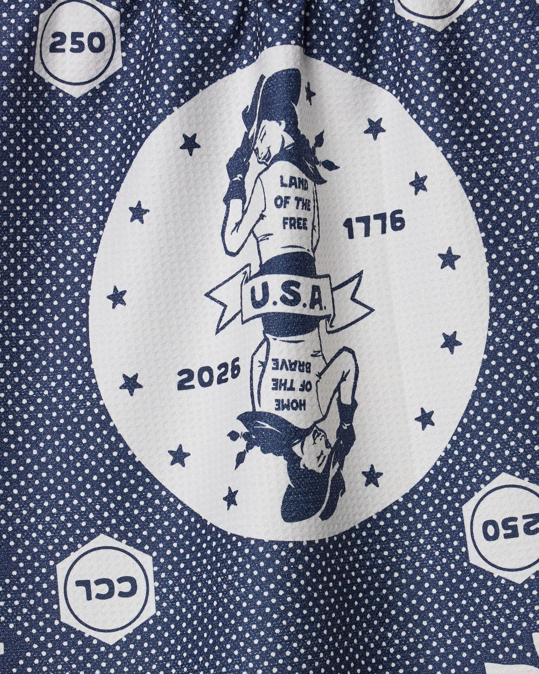 The Geometry USA Cowgirl kitchen tea towel features an ultra-absorbent, blue and white circular design with mirrored cowgirls, stars, and patriotic text—crafted from recycled materials for stylish, functional flair.