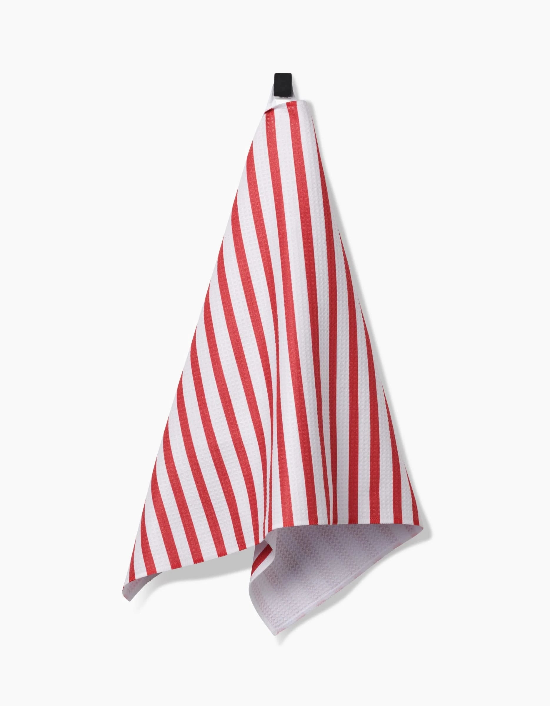 The Mindfulnice USA Stripes tea towel, made from Geoweave fabric, features red and white stripes and hangs from a black loop against a plain white background.