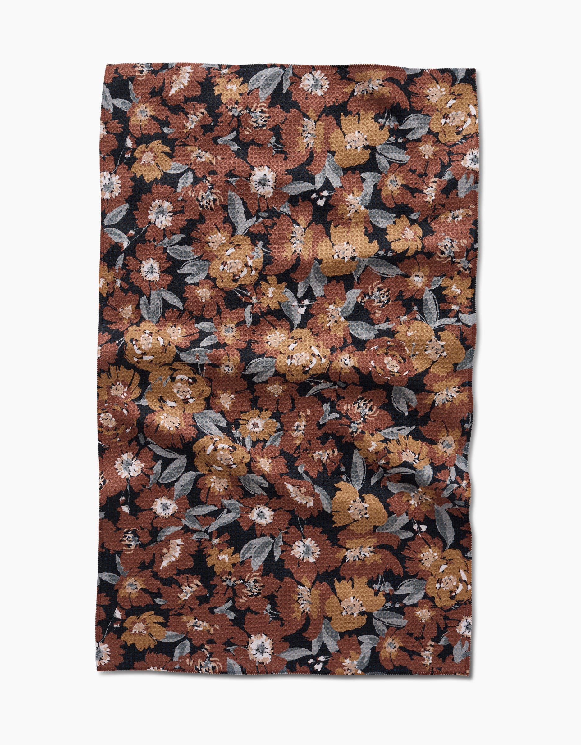 The Hufton Studio Vintage Floral Natural Tea Towel features a rectangular Geoweave fabric with a dense floral print in brown, orange, white, and gray on black. The ultra-absorbent towel has a slightly wrinkled texture.