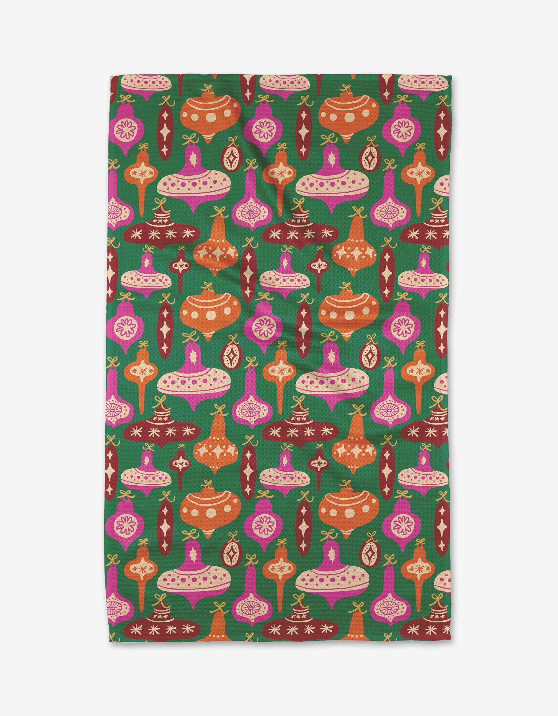 The Kayla Ann Vintage Ornaments tea towel features pink, orange, and red ornament patterns with geometric shapes on a green background—a festive design in various sizes perfect for brightening any kitchen.