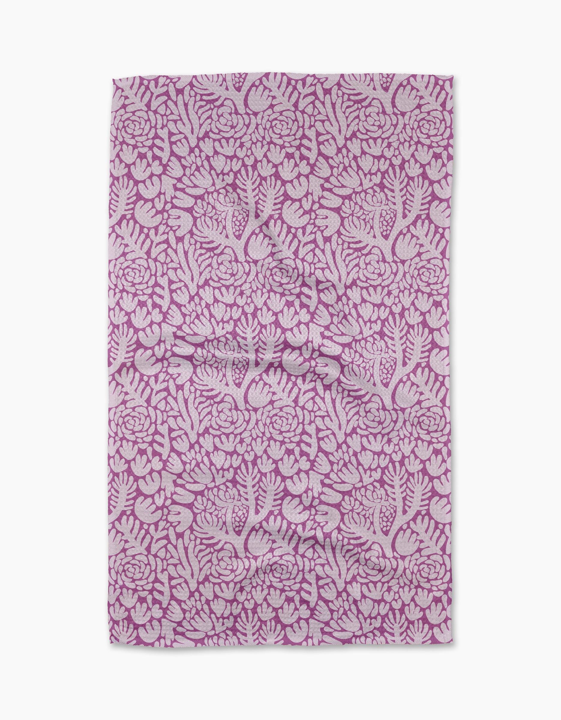 The Violet Paper Flowers tea towel by Katie OShea features an intricate floral pattern in pink and white, with densely arranged flowers and leaves—perfect for adding charm to any kitchen.