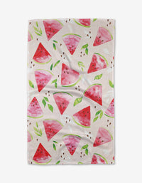 The Elena Fay Watermelon Slice Tea Towel is white with a watercolor watermelon and green leaf pattern, made from recycled materials for an eco-friendly touch.