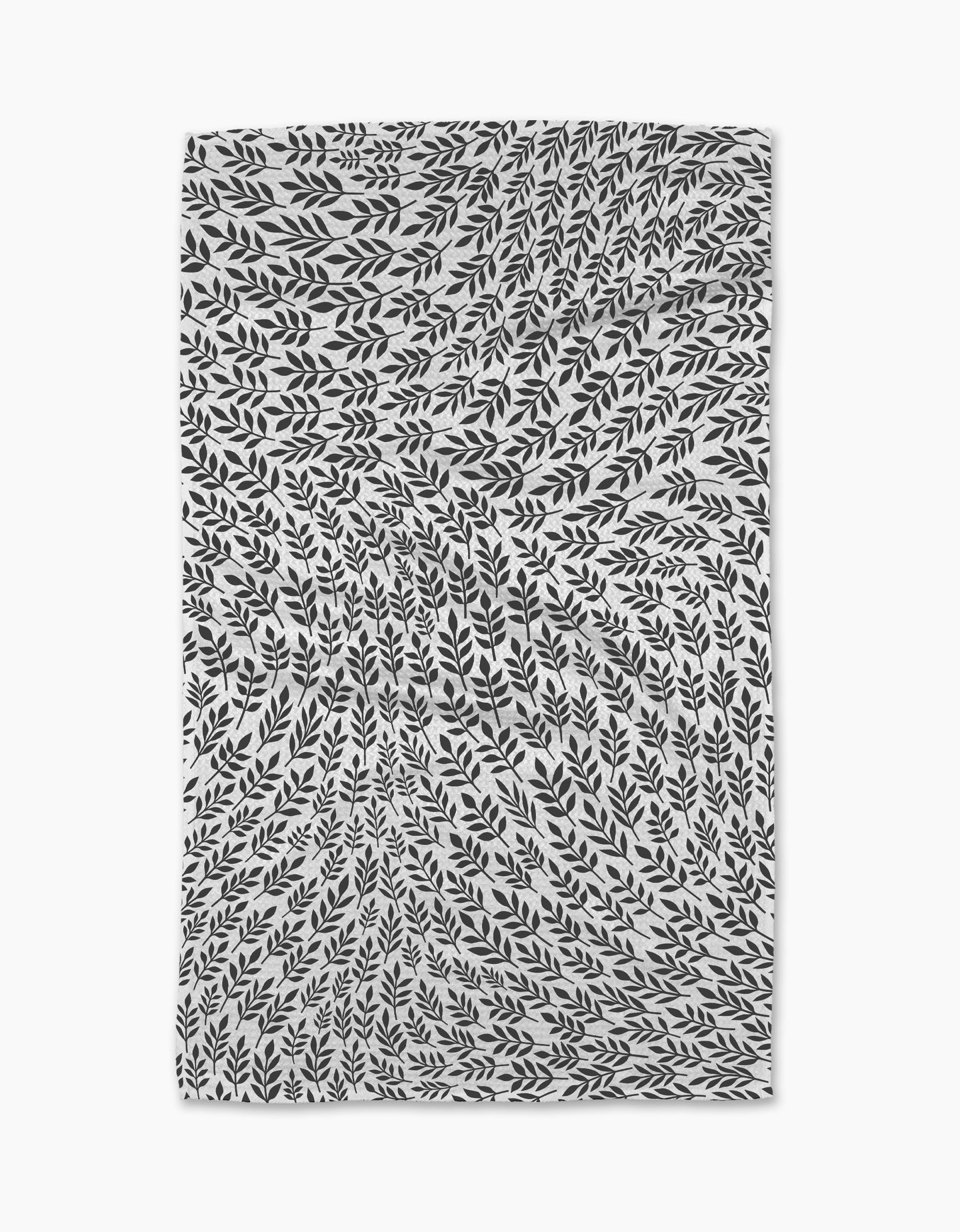 The Rachel Parker White Leaf Swirl tea towel features black leafy branches swirling in a hypnotic pattern on white, creating a dynamic, nature-inspired optical illusion that brings art and ultra-absorbent function to your kitchen.