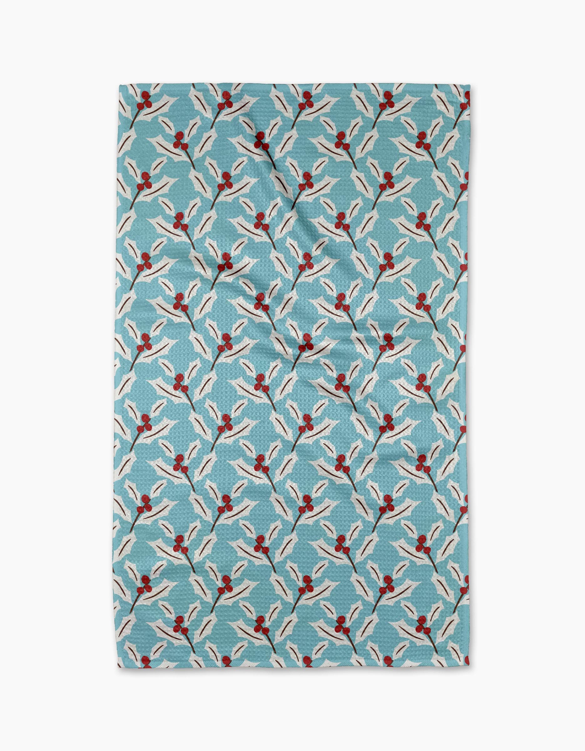 The Winter Holly tea towel by Lizzie Clark is rectangular and blue, featuring a pattern of illustrated swimmers in white swimsuits and red caps. Made from quick-drying recycled materials for everyday use.