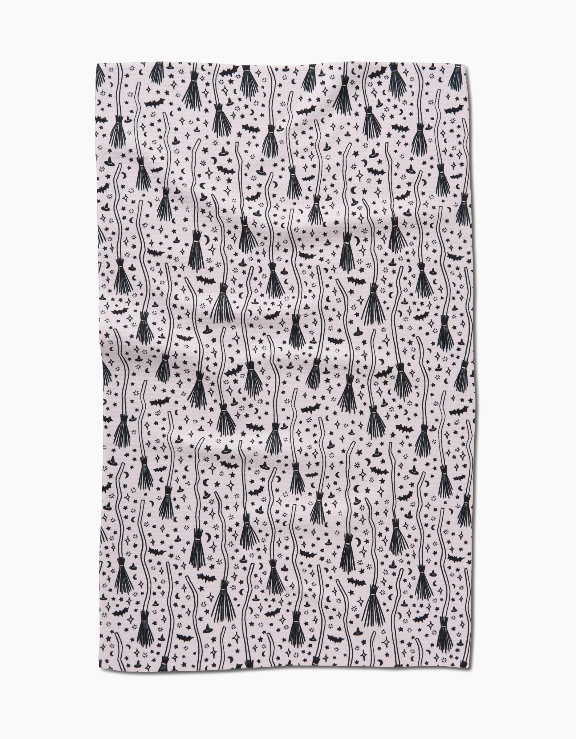 The Kayla Ann Witches Broom tea towel showcases black stylized jellyfish, wavy lines, and small dots on white—crafted from recycled materials for an eco-friendly touch.