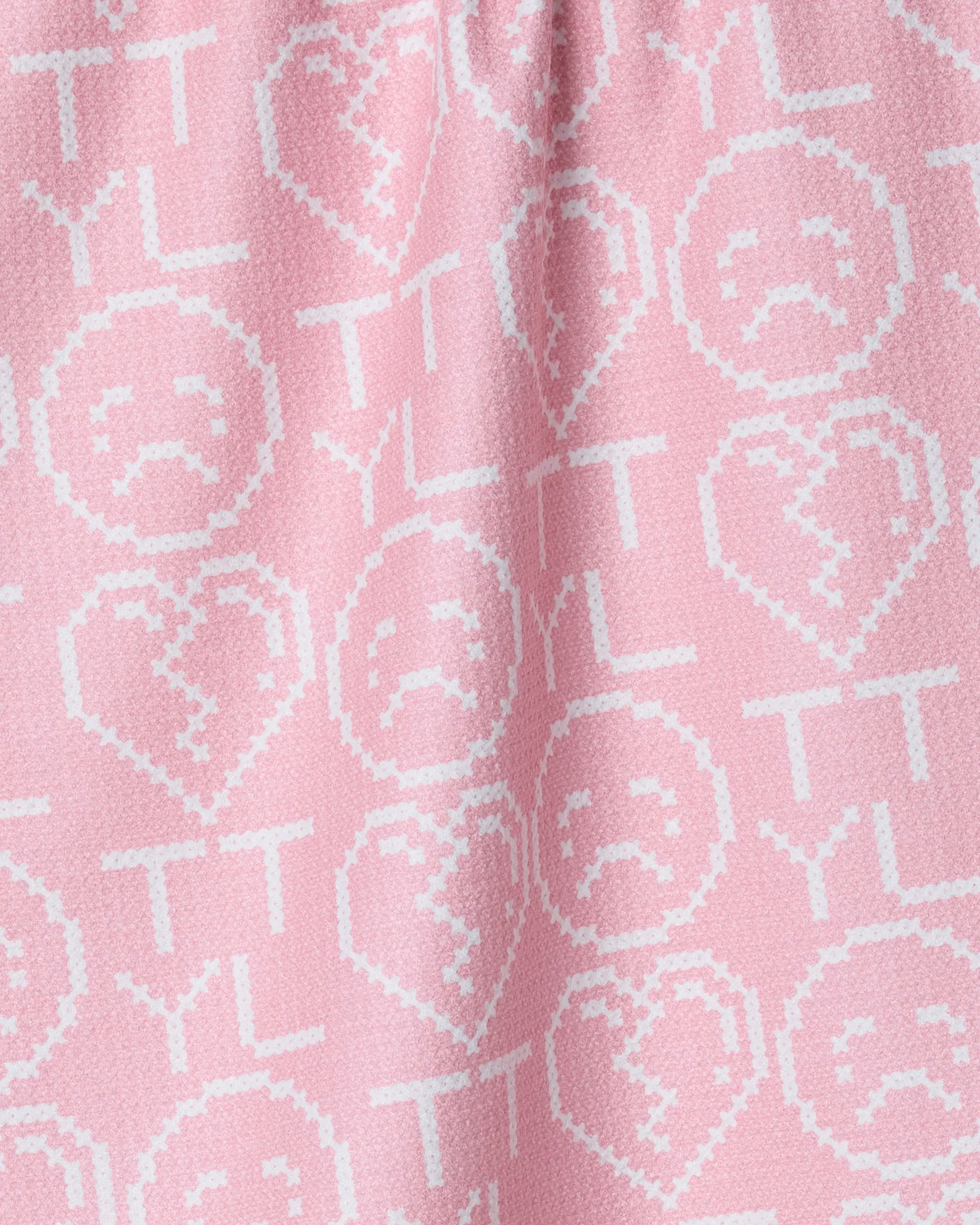 Playful and digitally inspired, the Geometry XOXOX Emoticon tea towel features a pink design with white pixelated sad faces in hearts, TTYL text, and icons—crafted from quick-drying recycled materials.