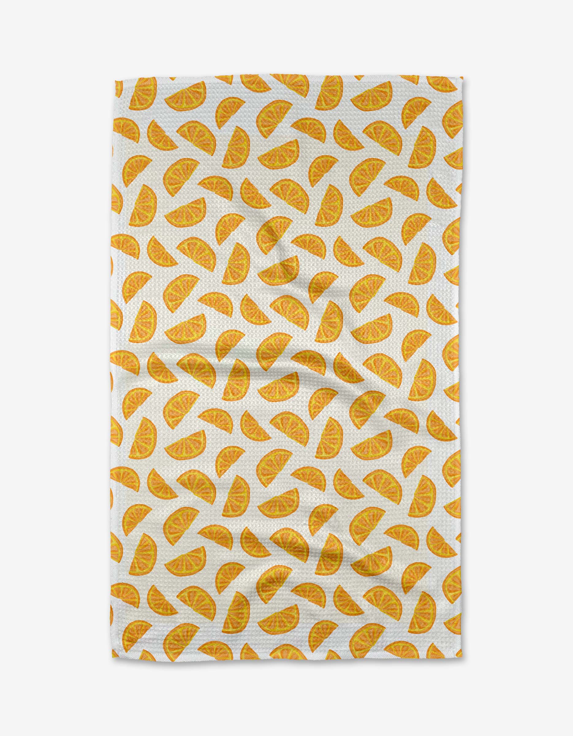 The Aubrey Fairchild Zesty Slice tea towel features a repeating pattern of yellow-orange citrus wedges on eco-friendly Geoweave fabric.