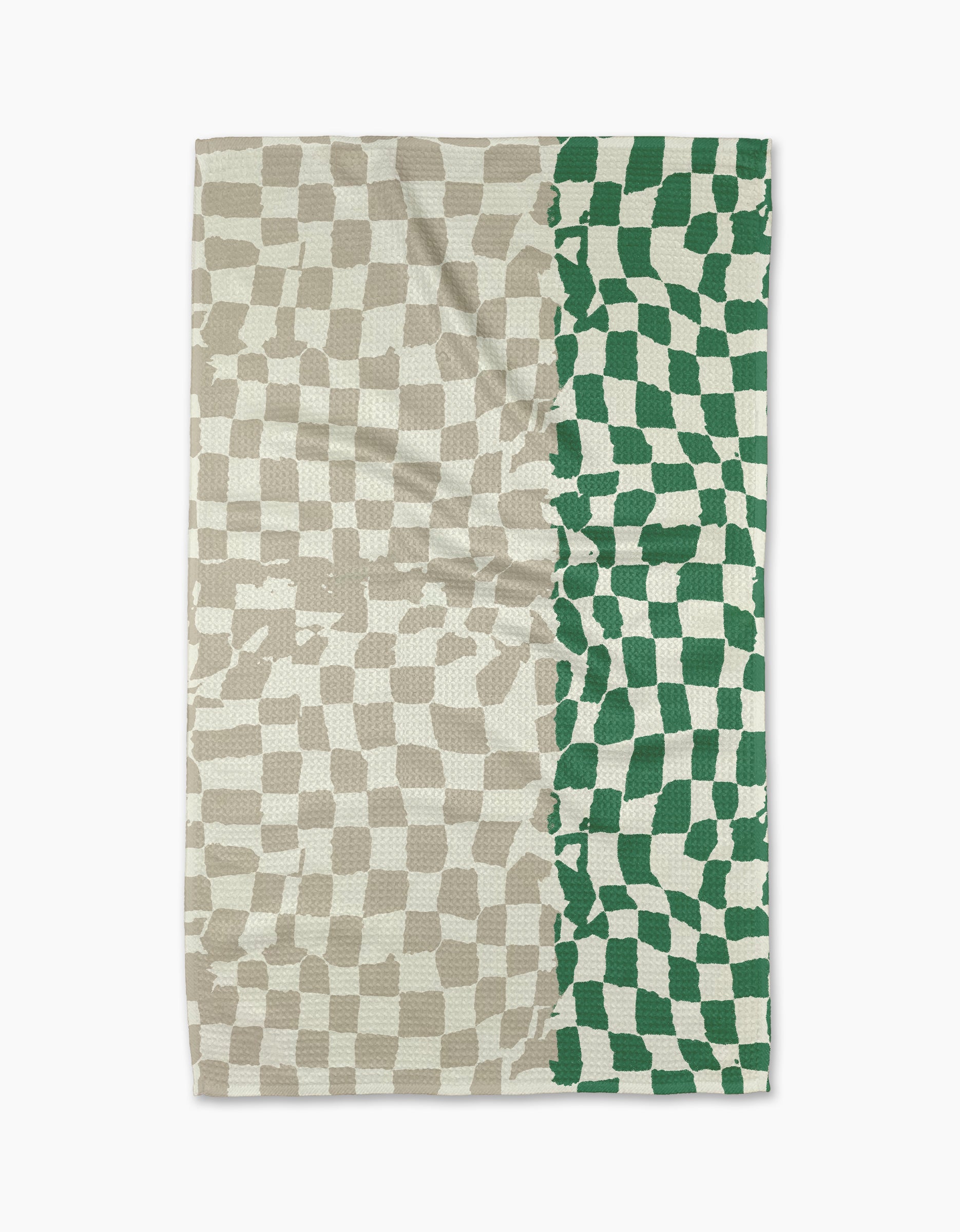 The Dual tea towel by Geometry features a wavy checkerboard pattern: beige and off-white cover the left three-quarters, while green and off-white fill the right quarter. Made from slightly wrinkled fabric, it blends style with practicality.