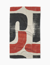 The Era tea towel by Geometry features bold, curved black and red abstract shapes on an off-white background with a slightly distressed finish, bringing artistic flair to your kitchen.