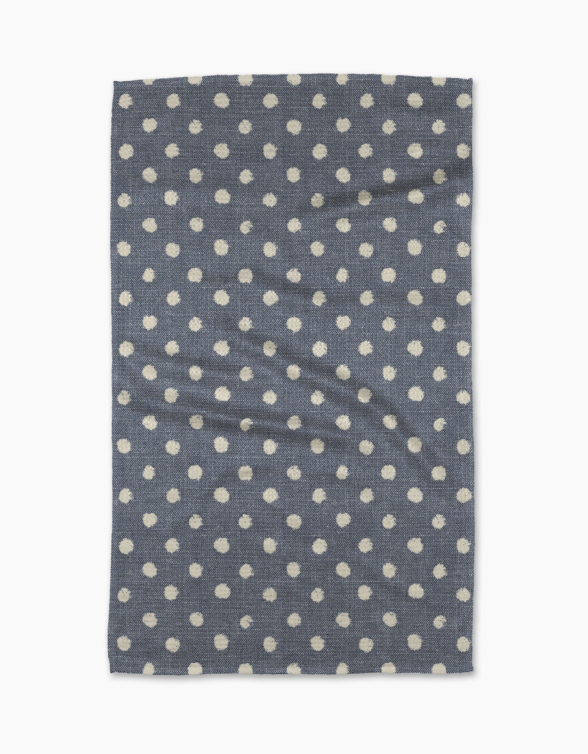 The Geometry Freckle Jean is a rectangular blue tea towel with evenly spaced white polka dots. Quick-drying and practical, it adds charm to any kitchen.