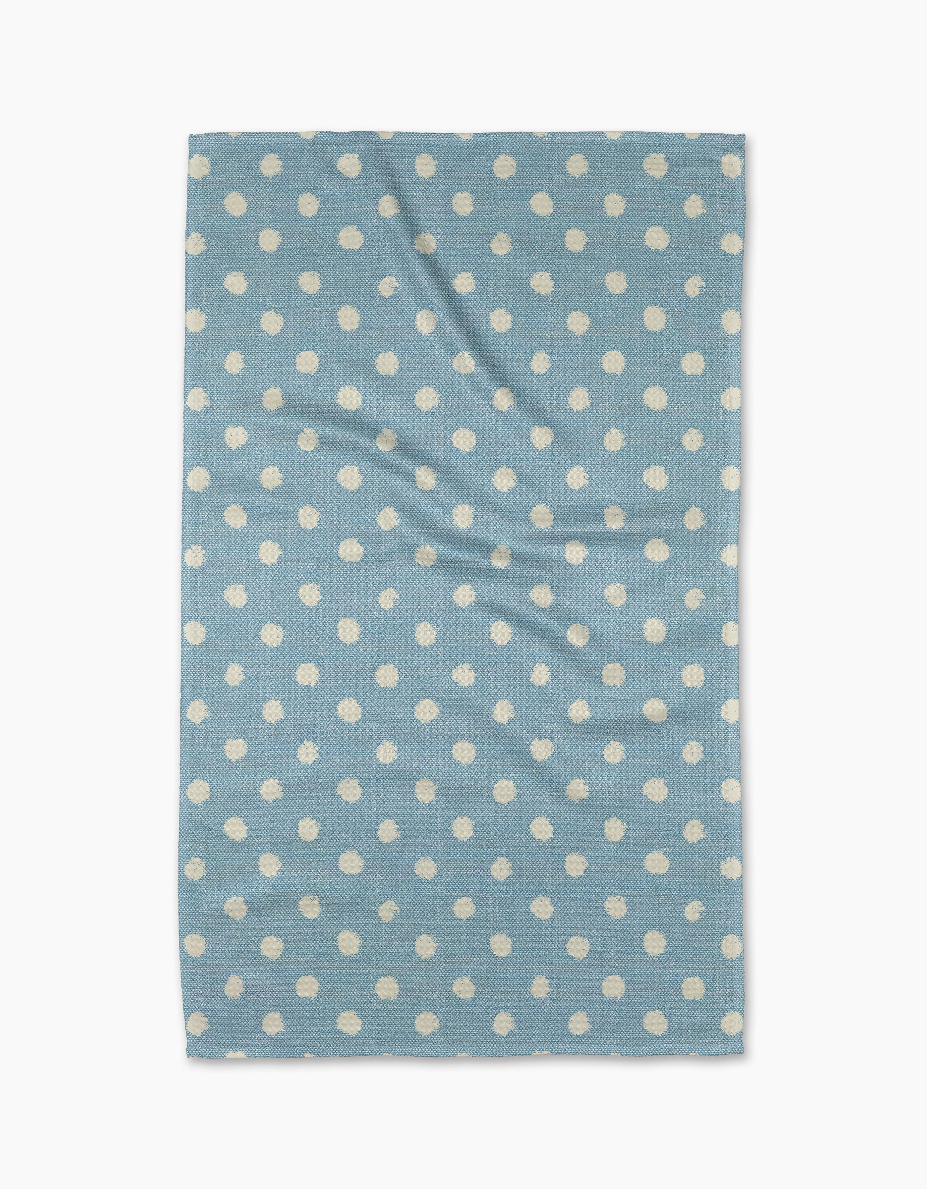 The Geometry Freckle Light Blue towel, featuring evenly spaced white polka dots on a rectangular light blue quick-drying fabric, is laid flat on a white background—ideal as a stylish and functional kitchen tea towel.