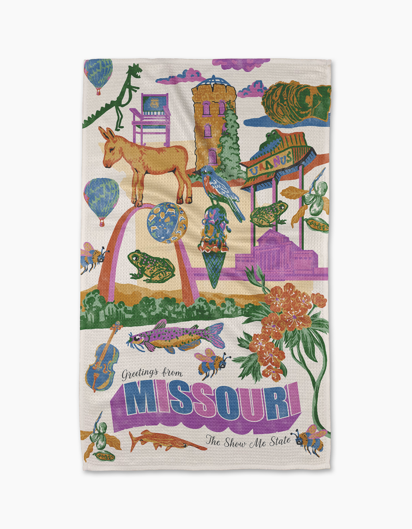 Geometry’s “Greetings From Missouri” tea towel showcases vibrant illustrations of state landmarks, animals, and flowers, with “Greetings from MISSOURI The Show-Me State” in purple and blue. Made from quick-drying recycled materials.