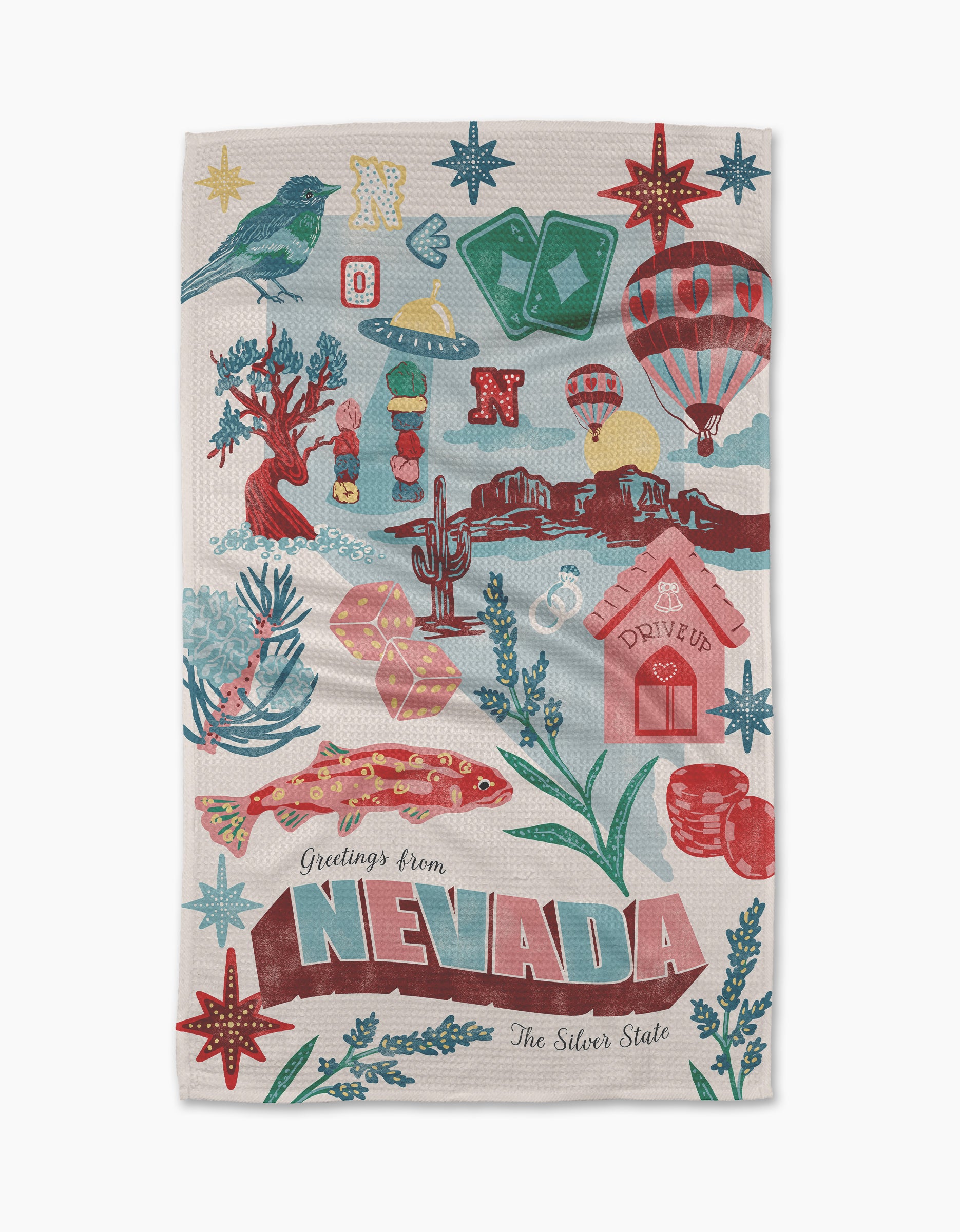 The Geometry Greetings From Nevada Tea Towel is made from post-consumer recycled materials and features a vibrant design with Nevada symbols: bird, hot air balloons, dice, cacti, cowboy boots, red rocks, and casino chips.