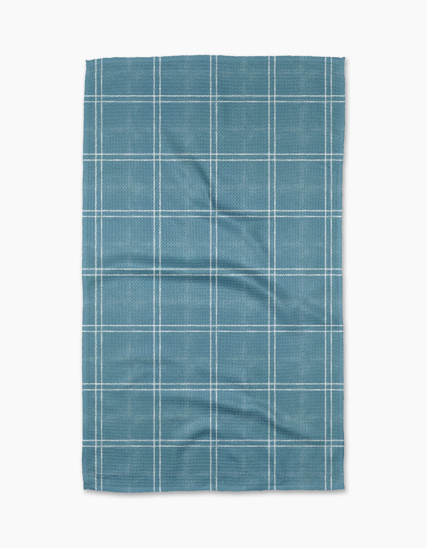 The Geometry Hearth Bay tea towel features a blue base with a white grid pattern. Ultra-absorbent and subtly wrinkled, this dish towel is shown laid flat against a white background.
