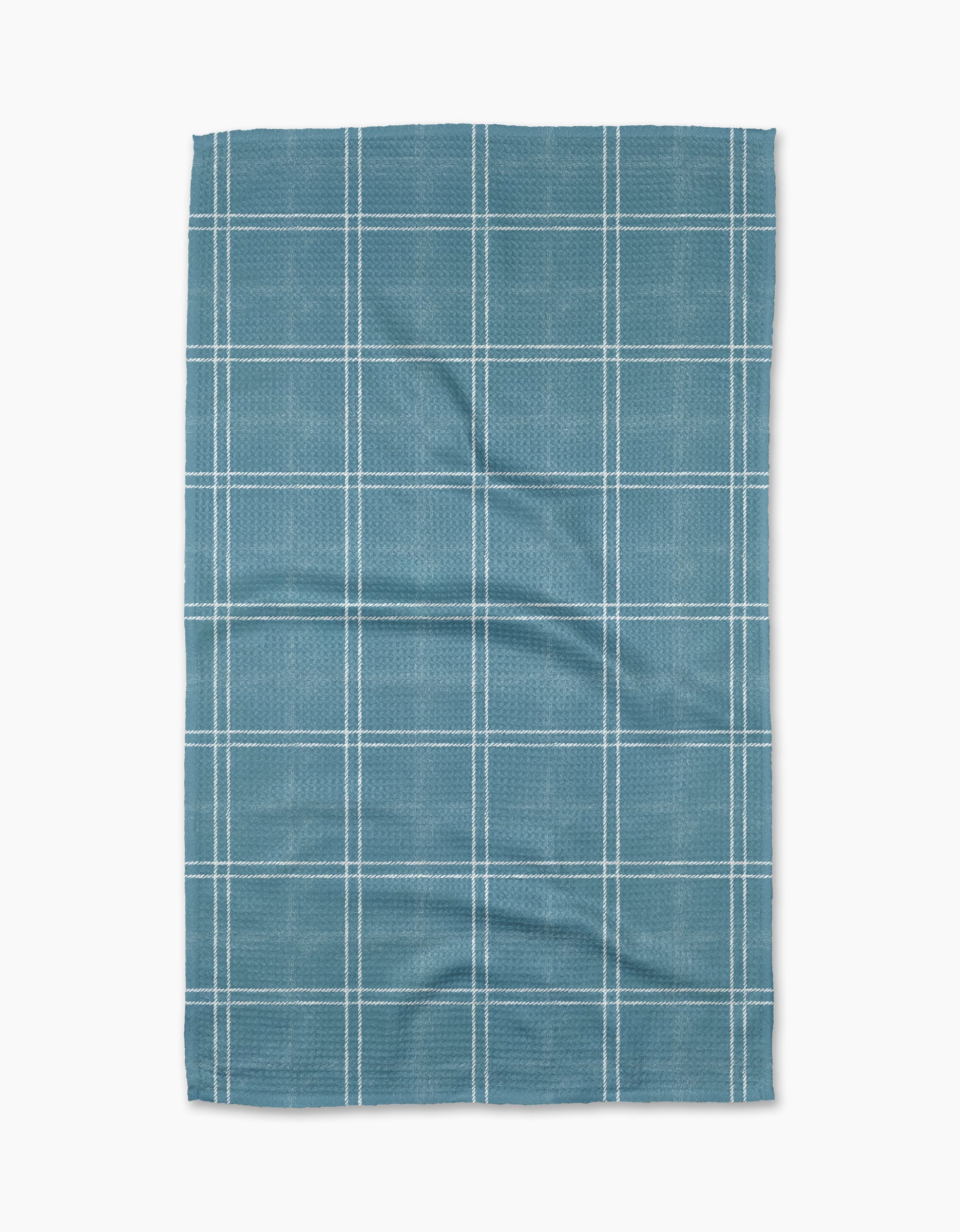 The Geometry Hearth Bay tea towel features a blue base with a white grid pattern. Ultra-absorbent and subtly wrinkled, this dish towel is shown laid flat against a white background.