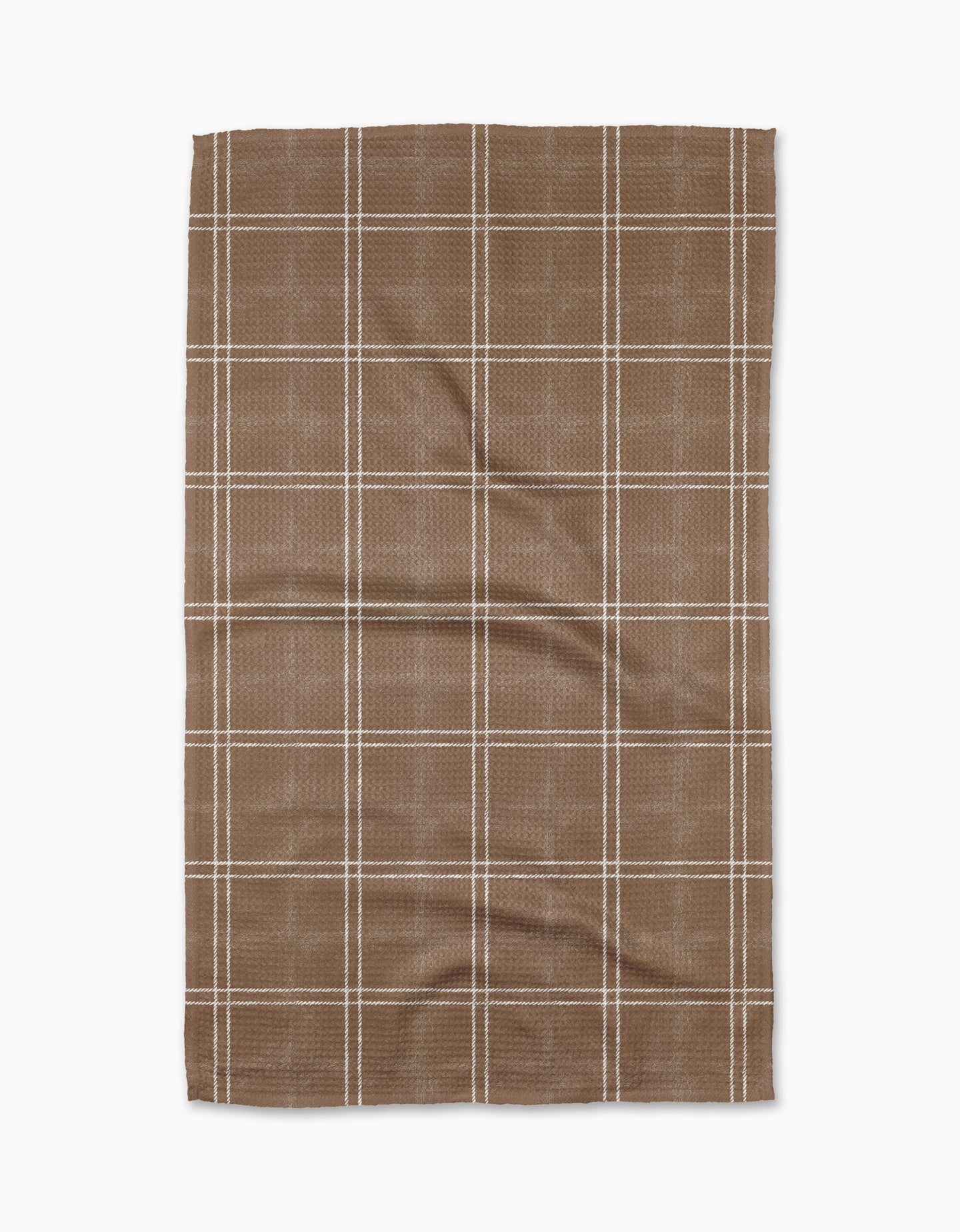 The Geometry Hearth Chestnut is a brown kitchen tea towel with a white checkered grid, laid flat on a white background. Made from recycled materials, its fabric is slightly textured with visible creases.